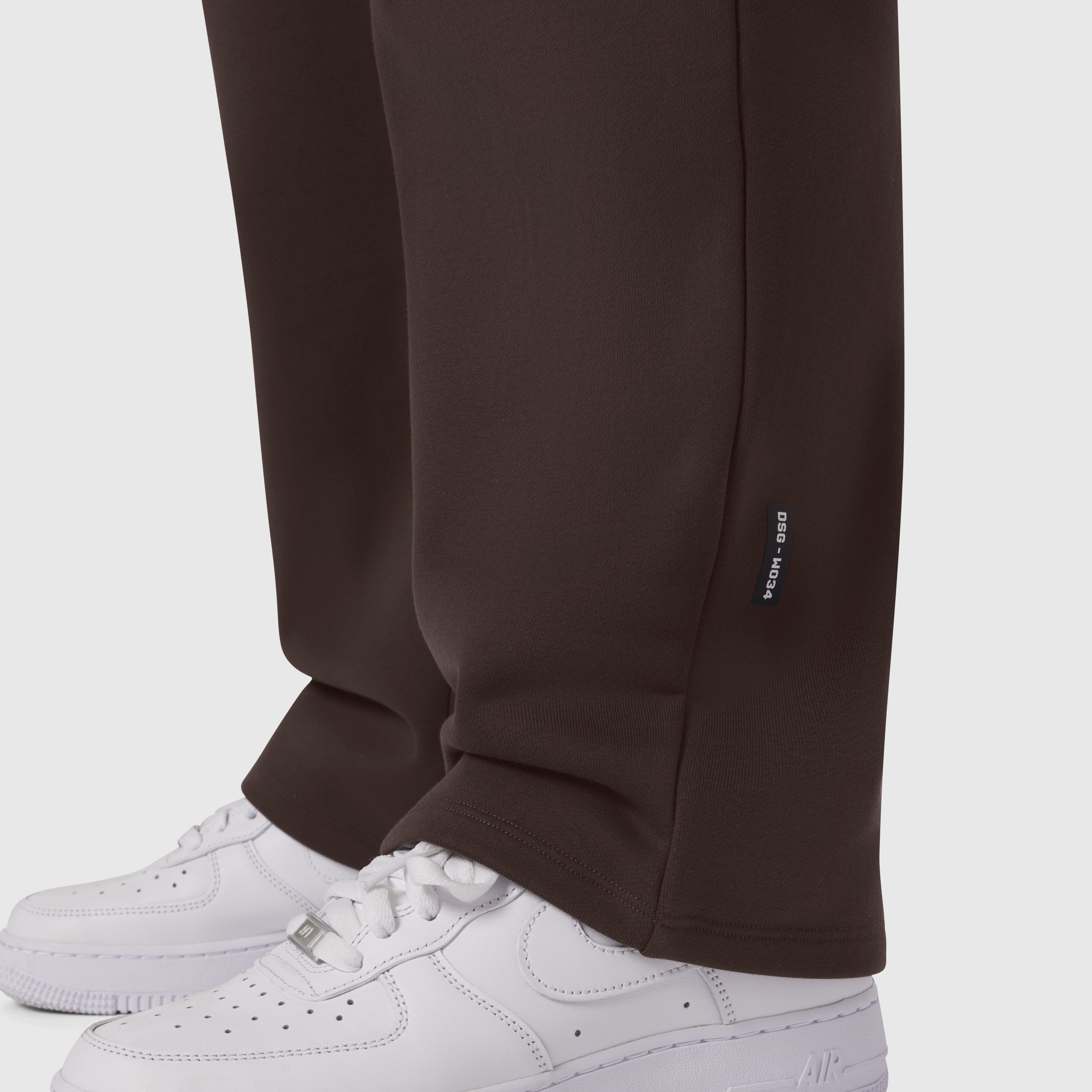 Dark Earth Sorona® Terry straight leg sweats on model wearing white sneakers, cropped view