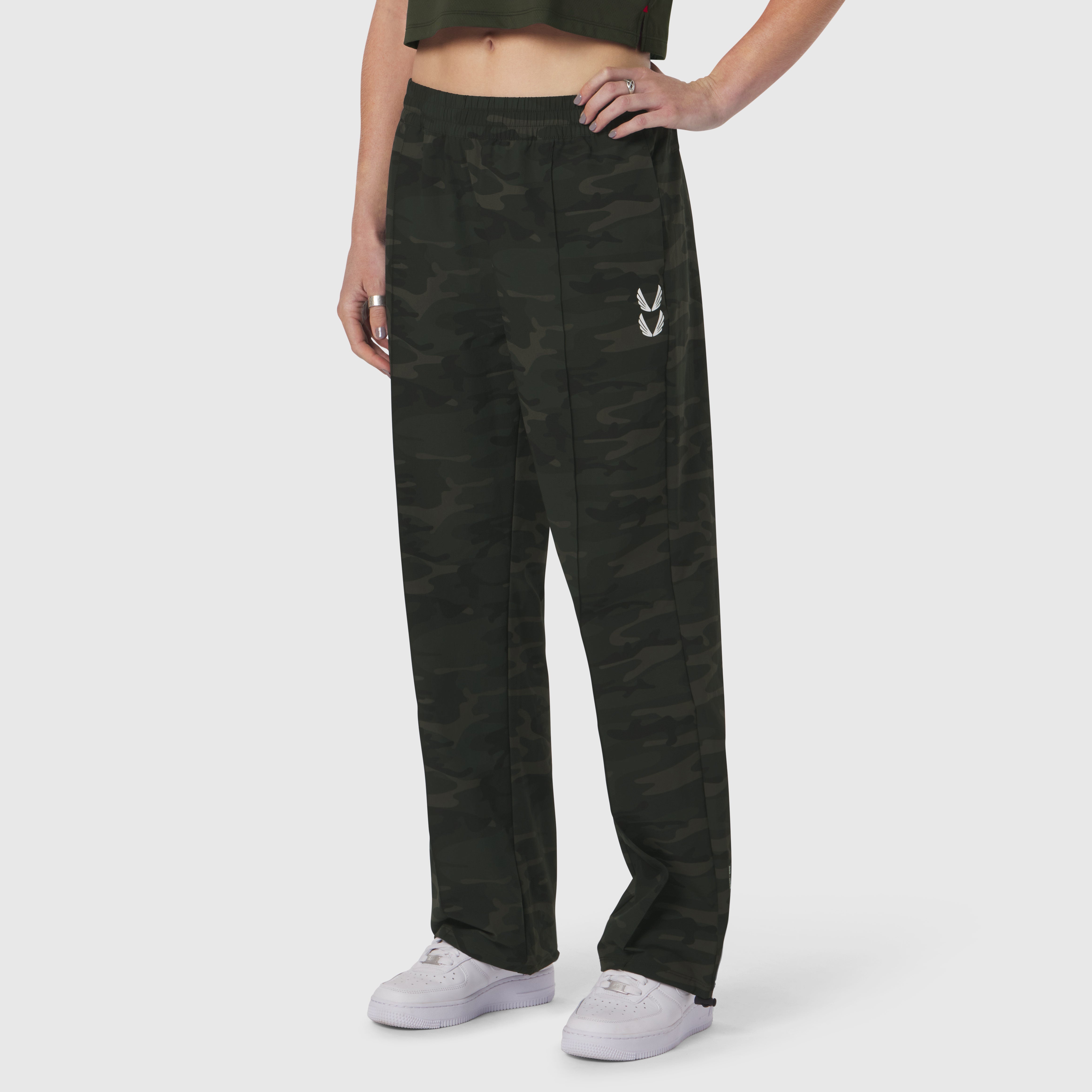 W036 Ripstop Relaxed Track Pant in dark camo, worn by model with hands on hips