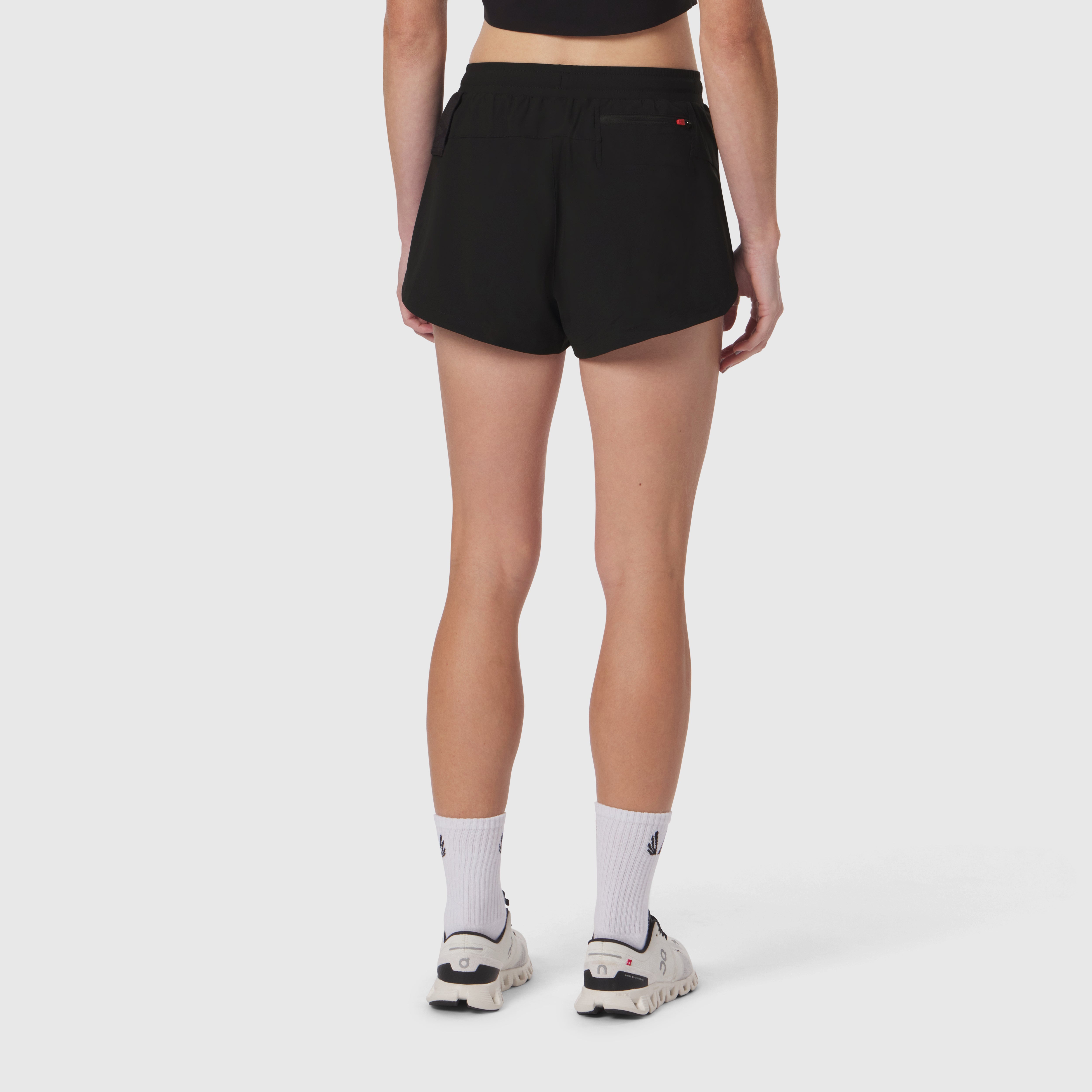 W037 Tetra-Lite Linerless Short in black, back view on model