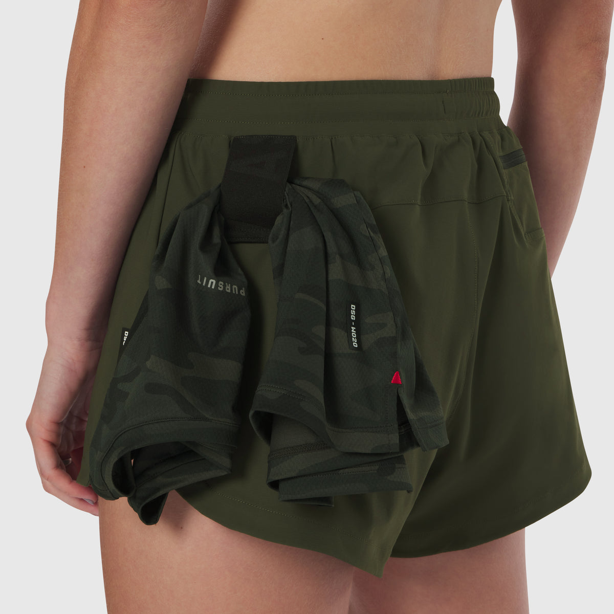 Tetra-Lite Linerless Short in olive worn by model, back view with bundled shorts