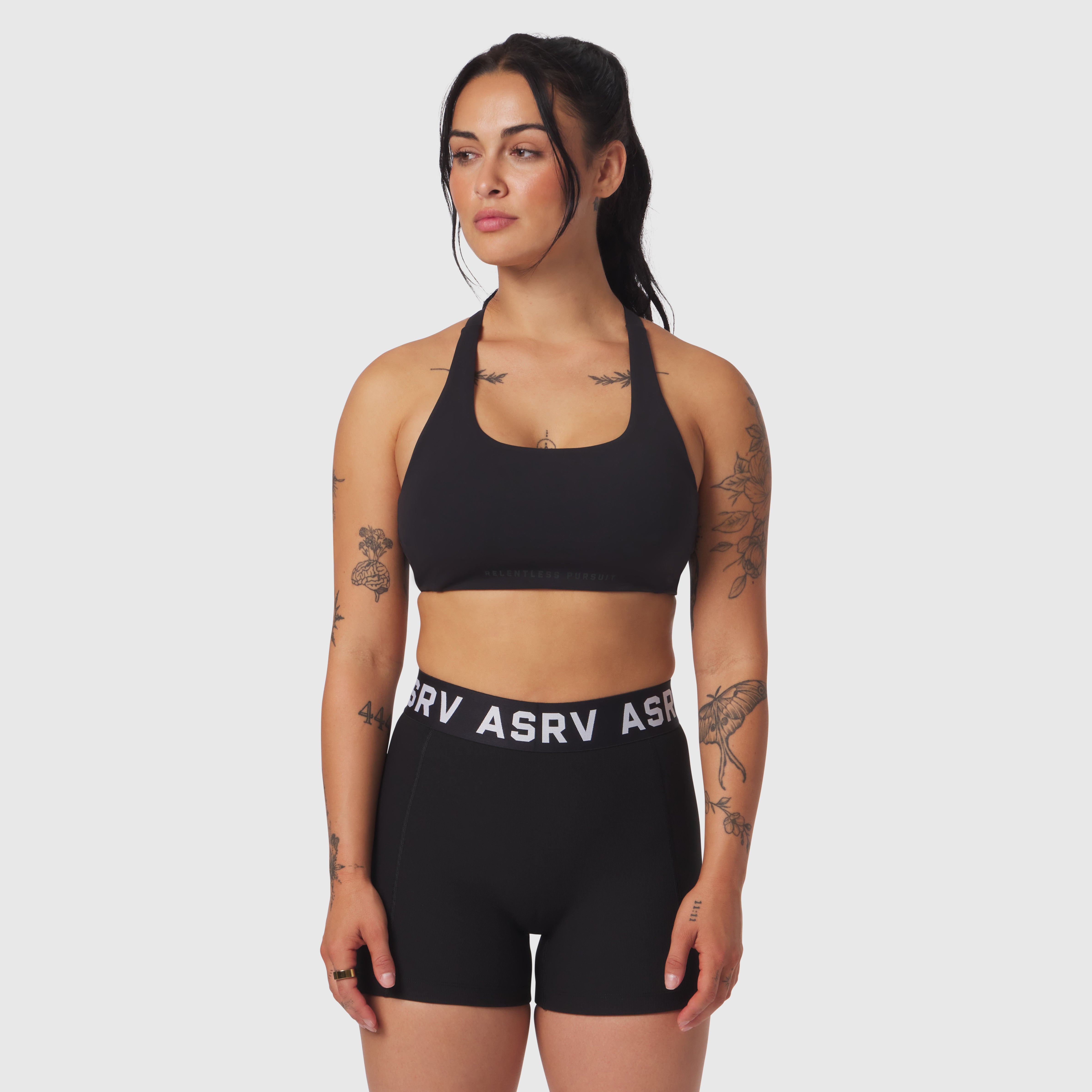 Black LYCRA® Hybrid Sports Bra worn by model, front view
