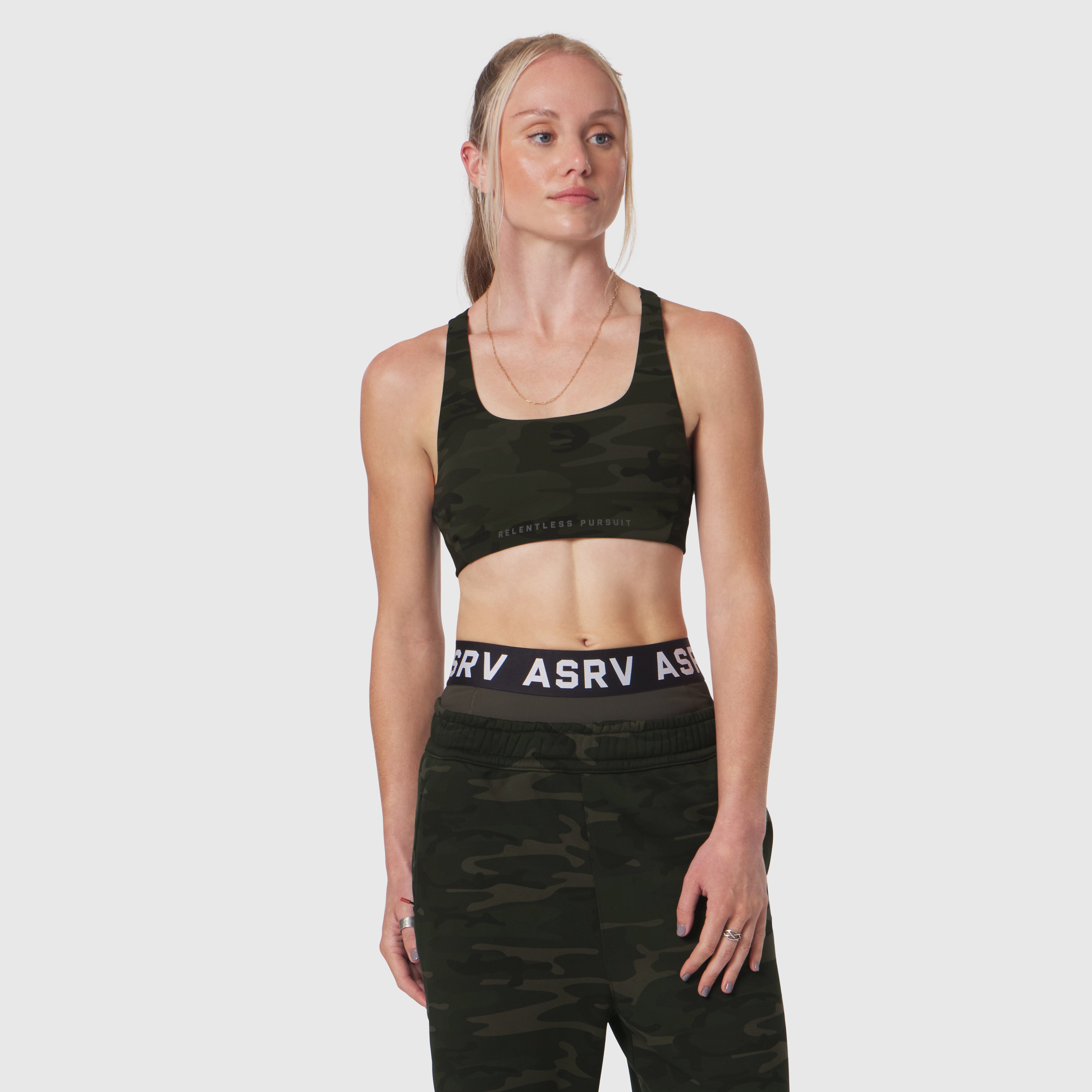 W039 Lycra Hybrid Sports Bra in dark camo, front view on model