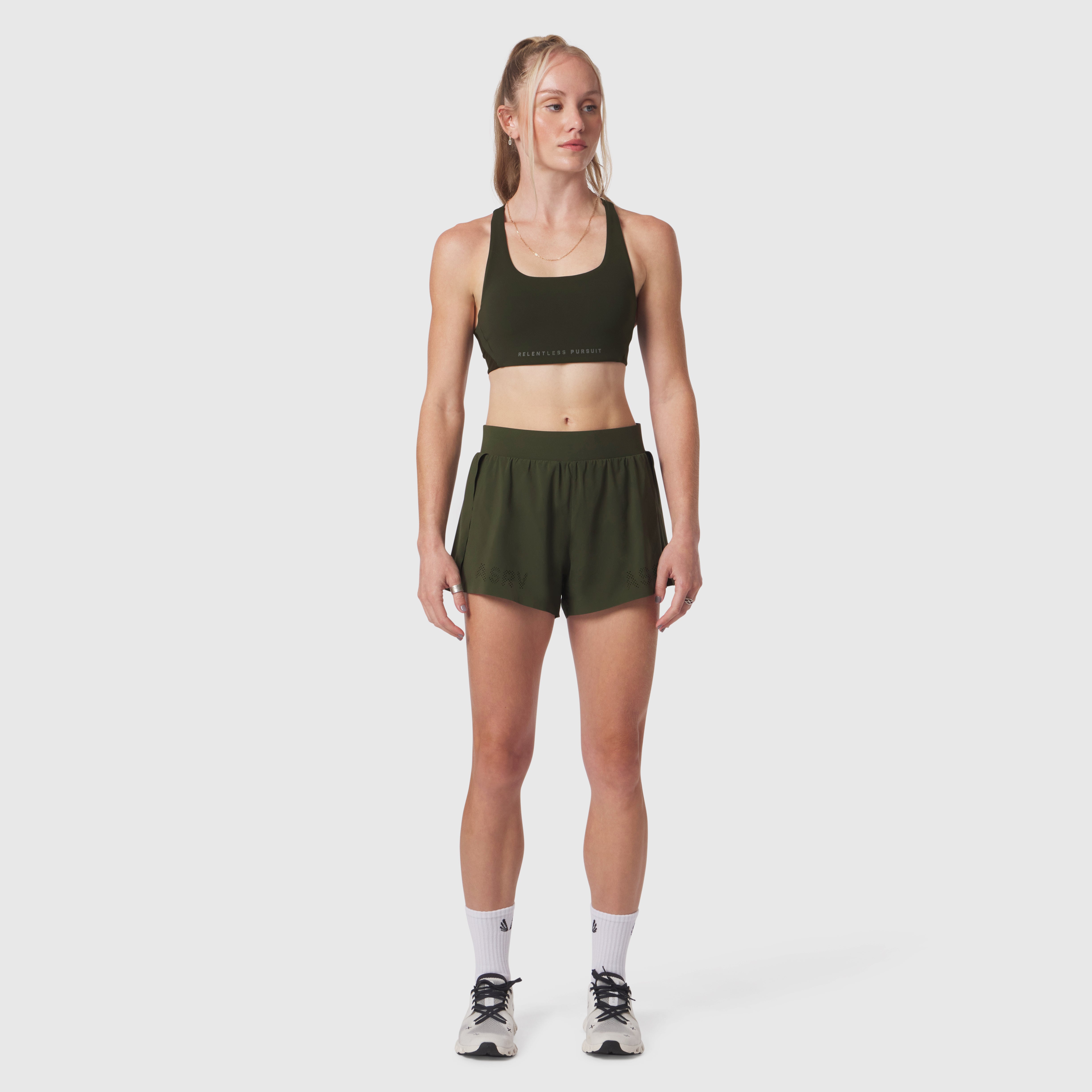 W039 Lycra Hybrid Sports Bra in olive, worn with matching shorts on model