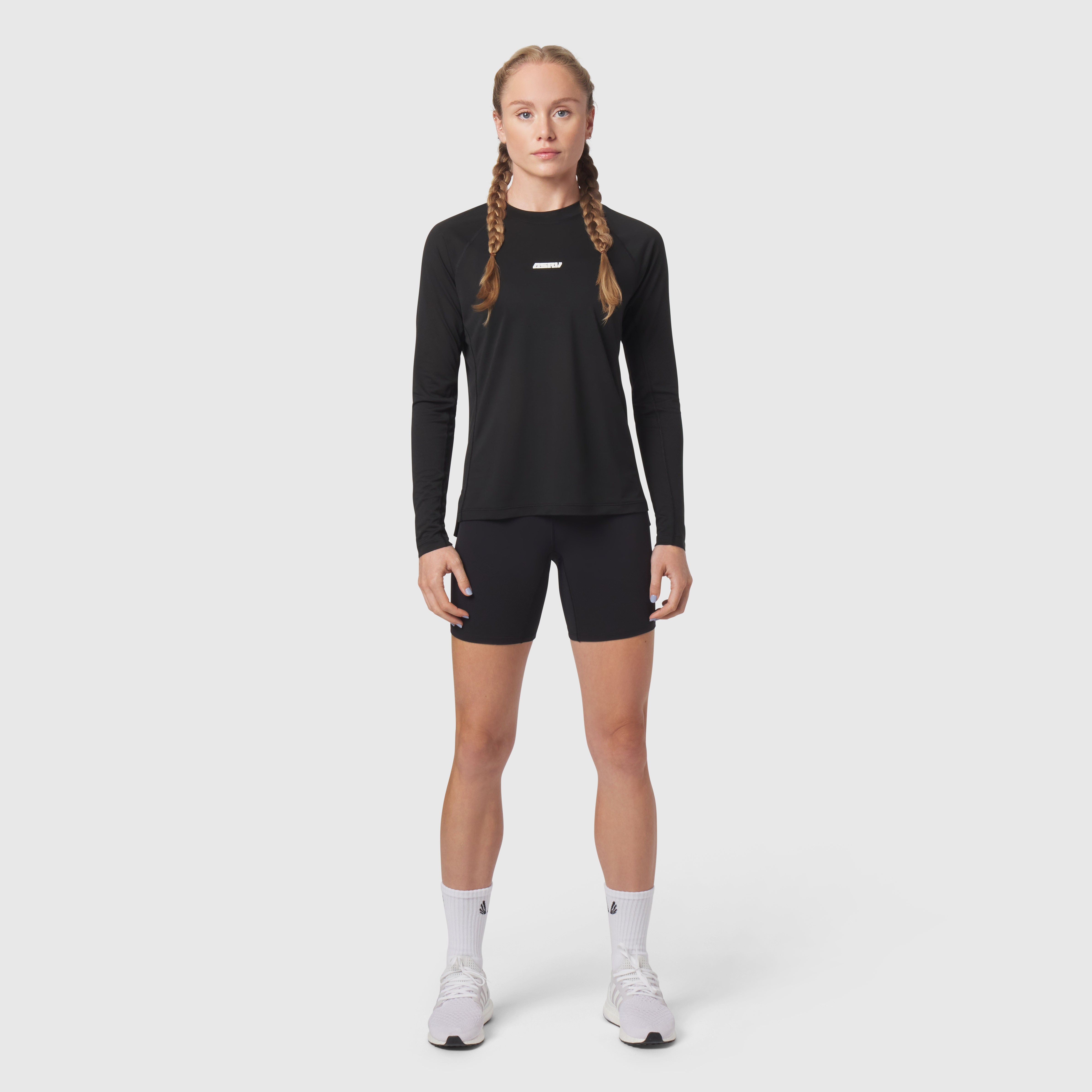 Polartec® Delta Longsleeve in black, worn by model with matching shorts and white socks