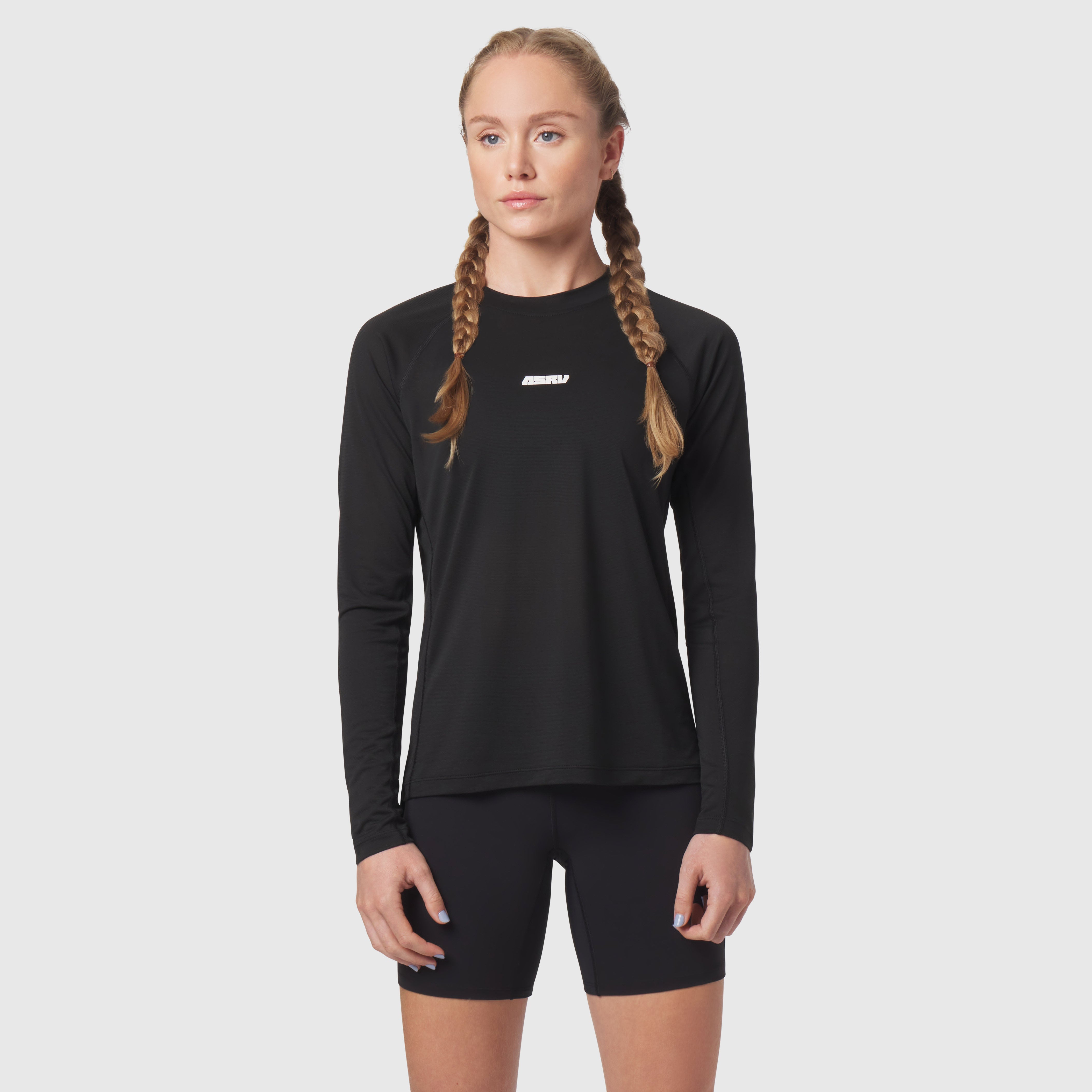 Polartec® Delta Longsleeve in black, worn by model with braided hair, front view