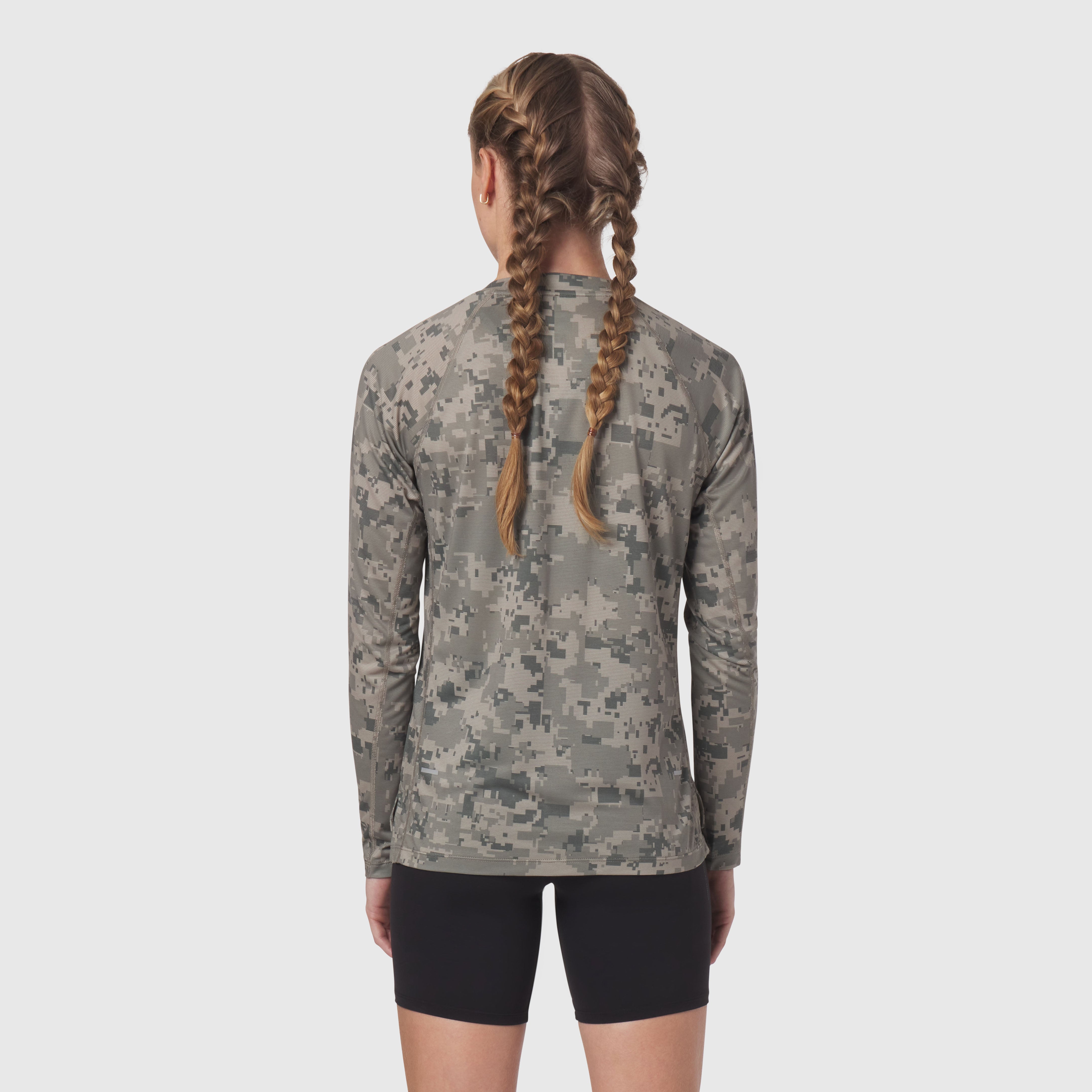 Polartec Delta longsleeve in digital camo, back view on model with braided hair