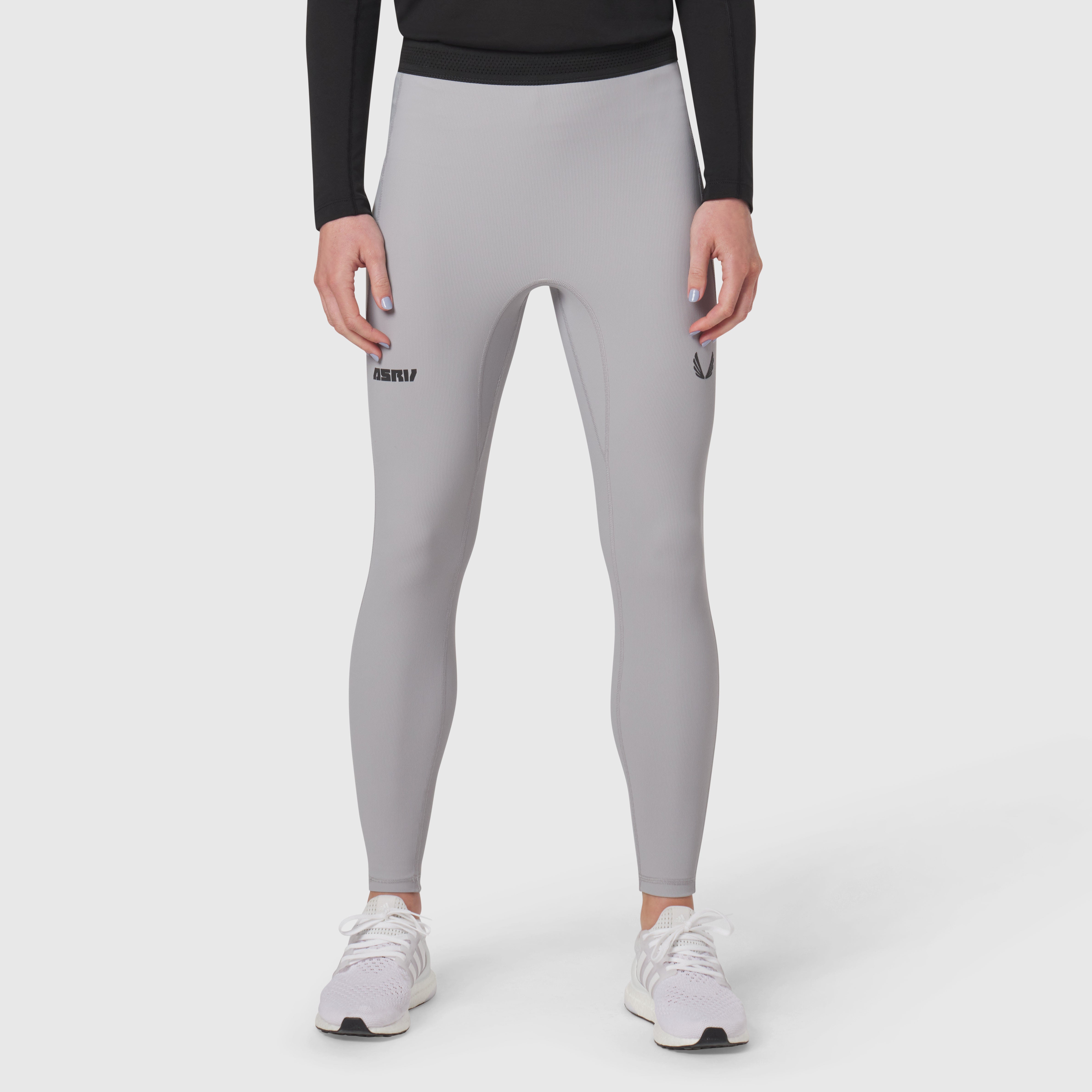 Lycra Ribbed Running Tight in slate grey worn by model with white sneakers, front view