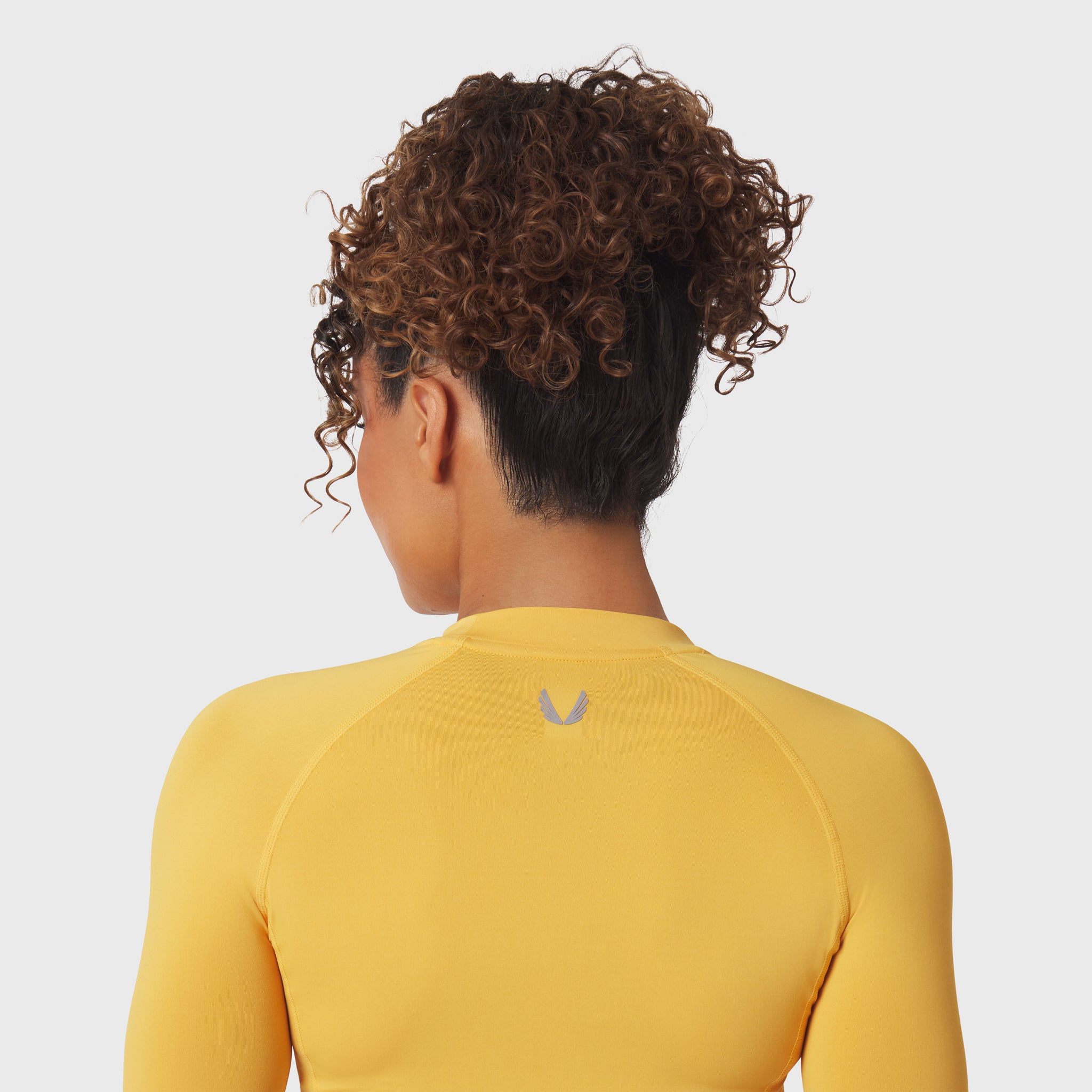 LYCRA® ADAPTIV baselayer longsleeve in amber, back view on model
