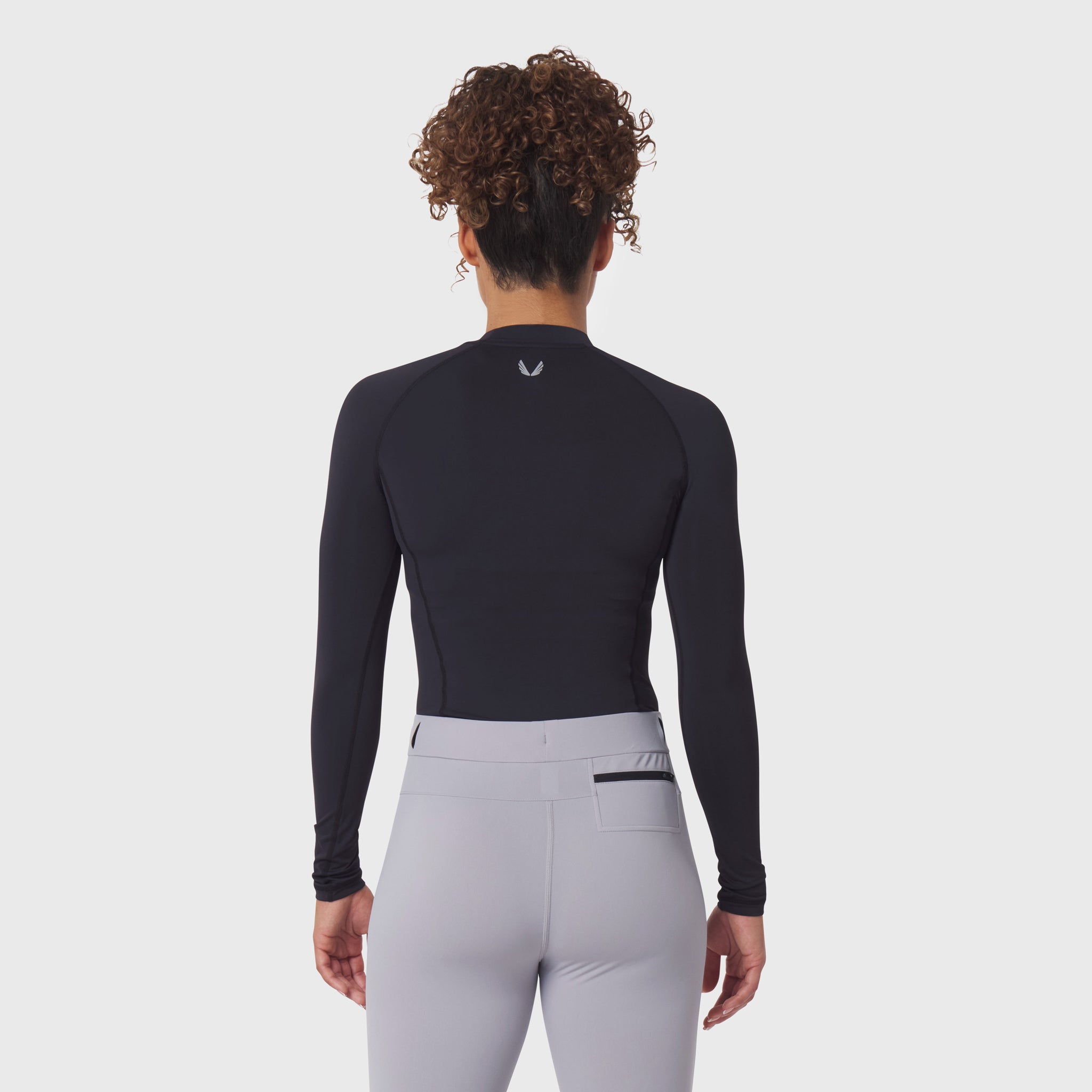 LYCRA® ADAPTIV Baselayer Longsleeve in black, back view on model