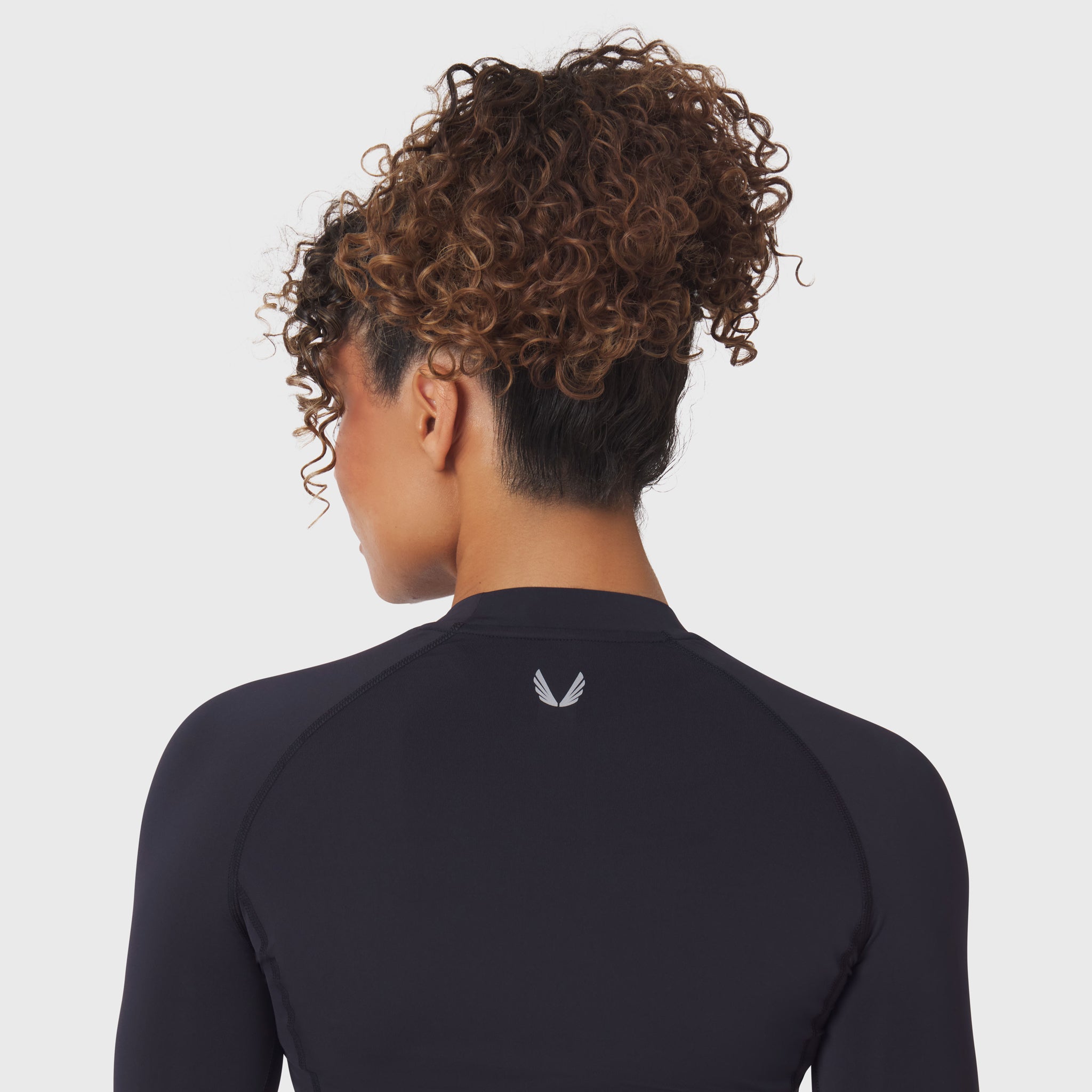 LYCRA® ADAPTIV Baselayer Longsleeve in black, back view on model