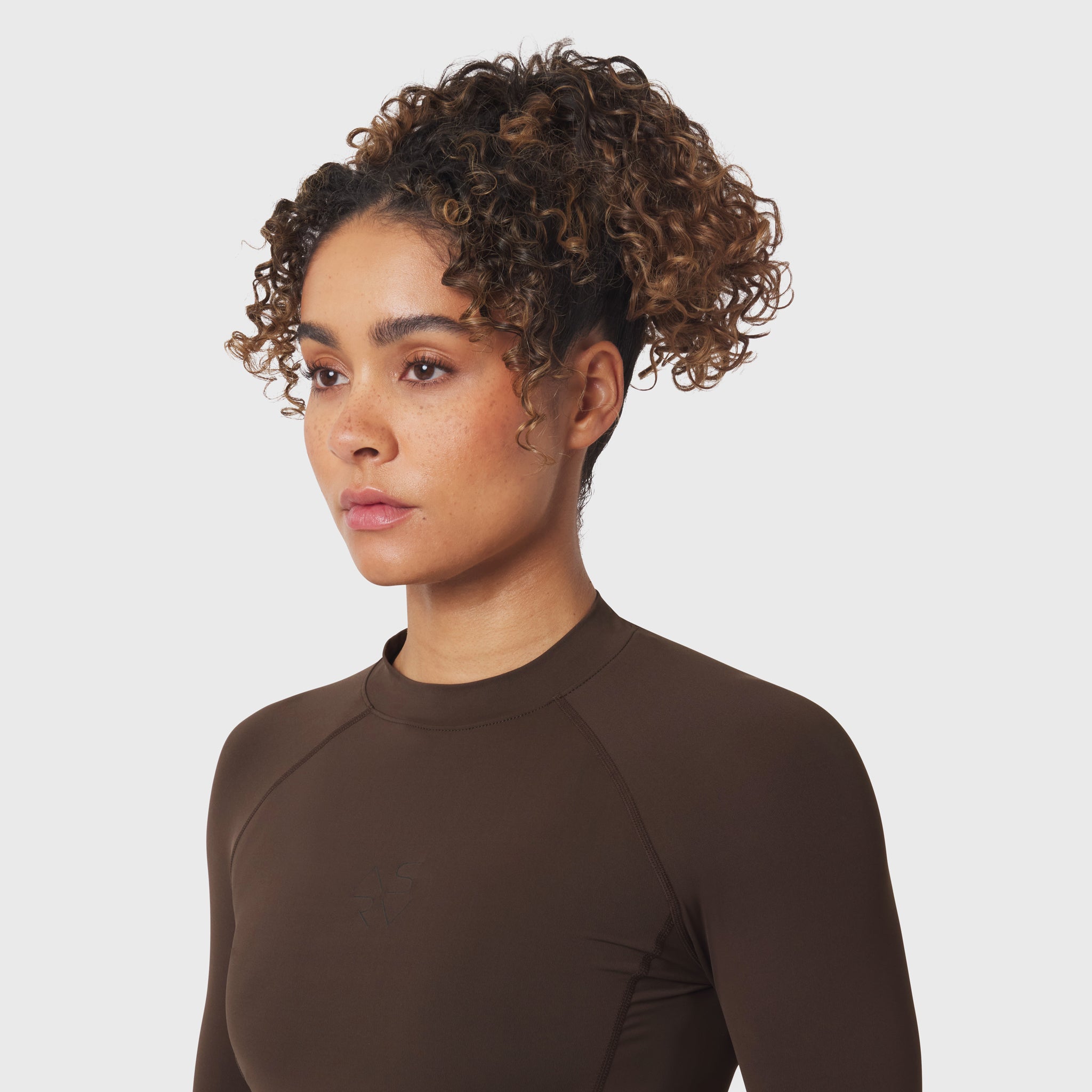 LYCRA® ADAPTIV Baselayer Longsleeve in Dark Earth, worn by model, front-facing pose