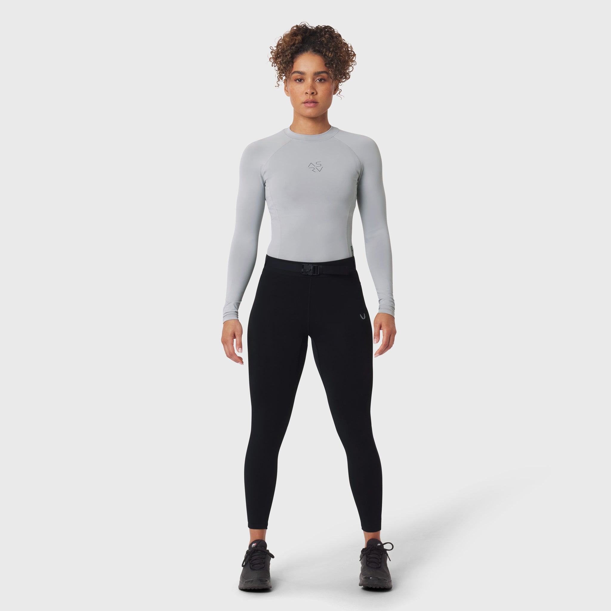 LYCRA® ADAPTIV Baselayer Longsleeve in slate grey, worn with black leggings, front view