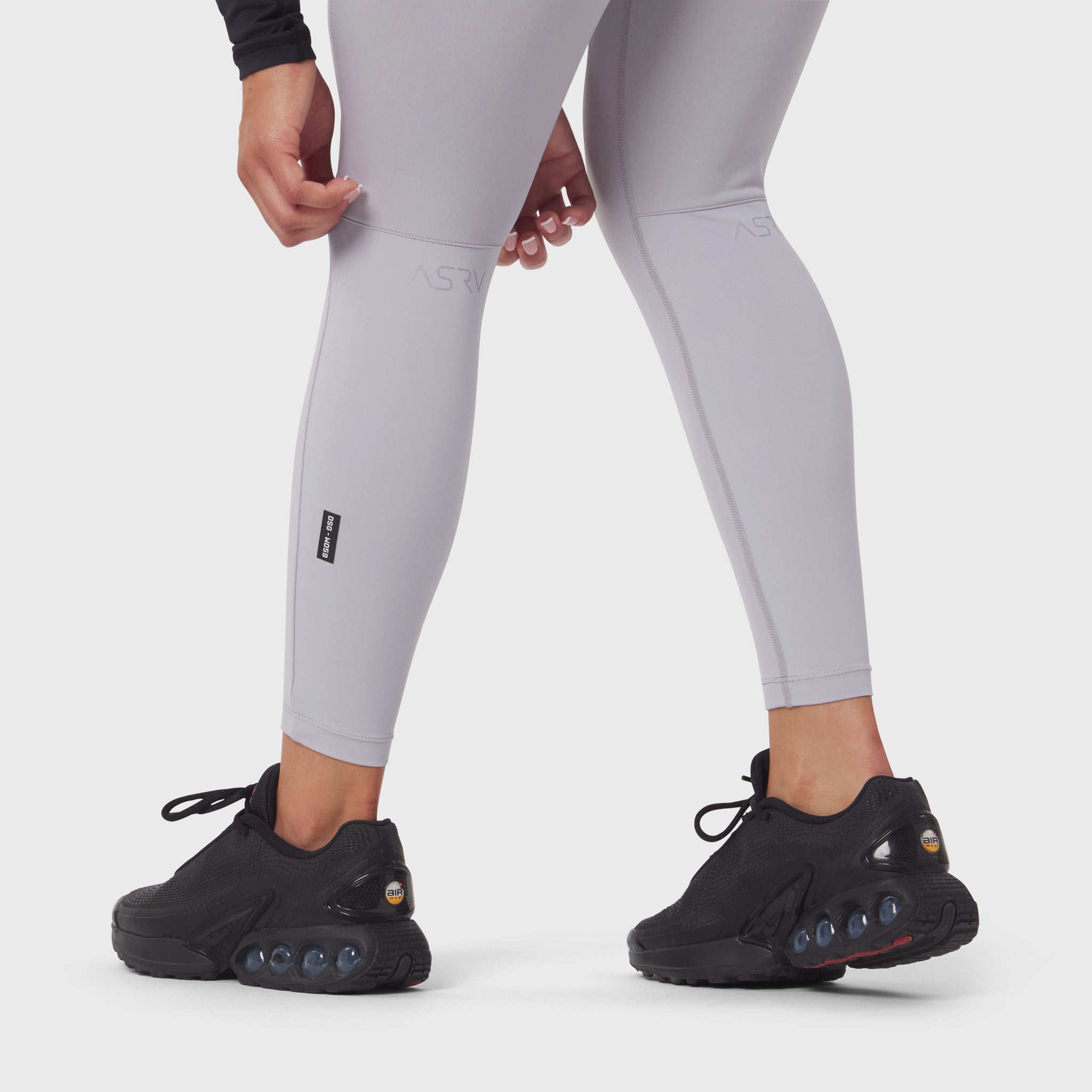 W059 Hybrid Belt-Pack Run Legging in slate grey worn with black sneakers, front view