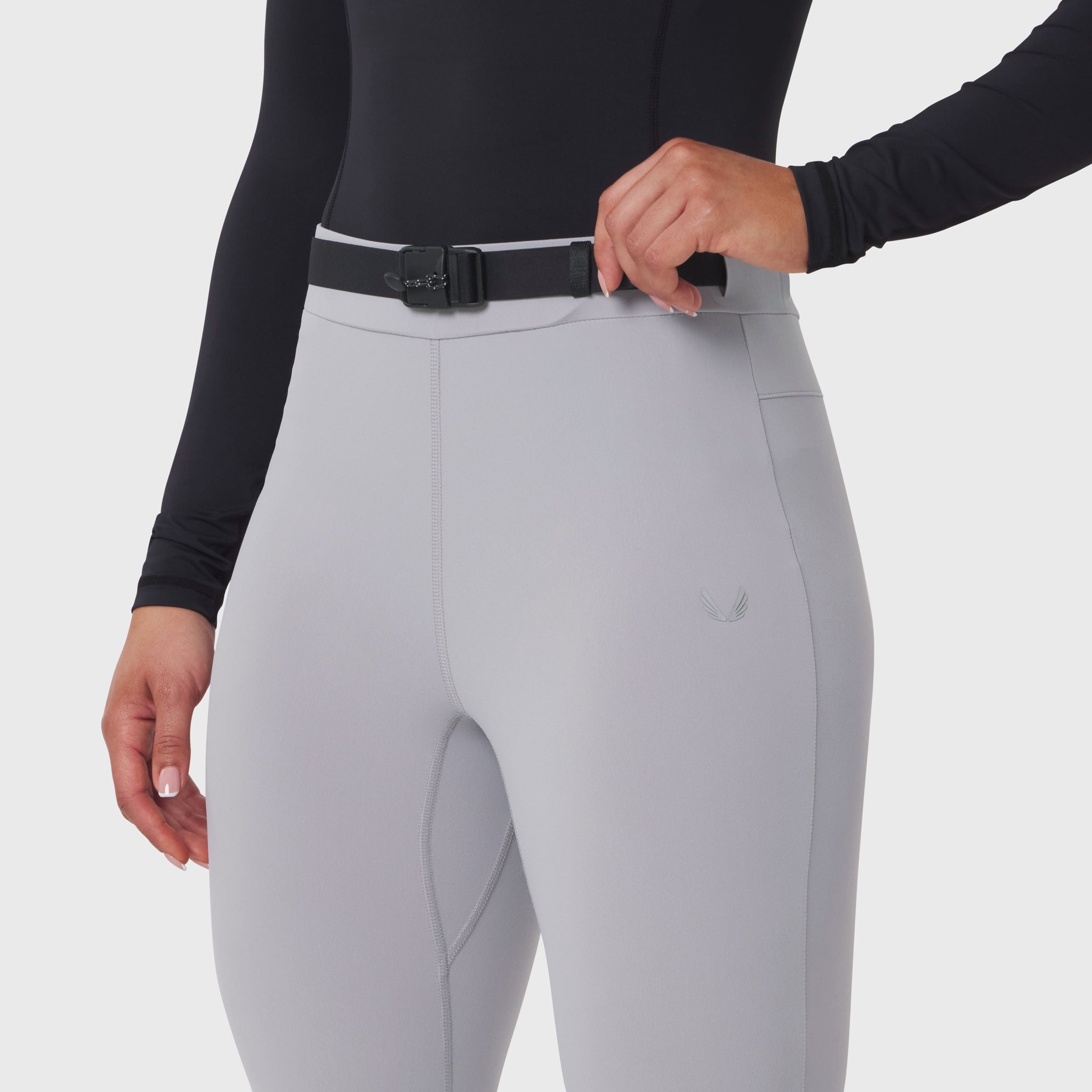 W059 Hybrid Belt-Pack Run Legging in Slate Grey, worn with black long-sleeve top and black belt