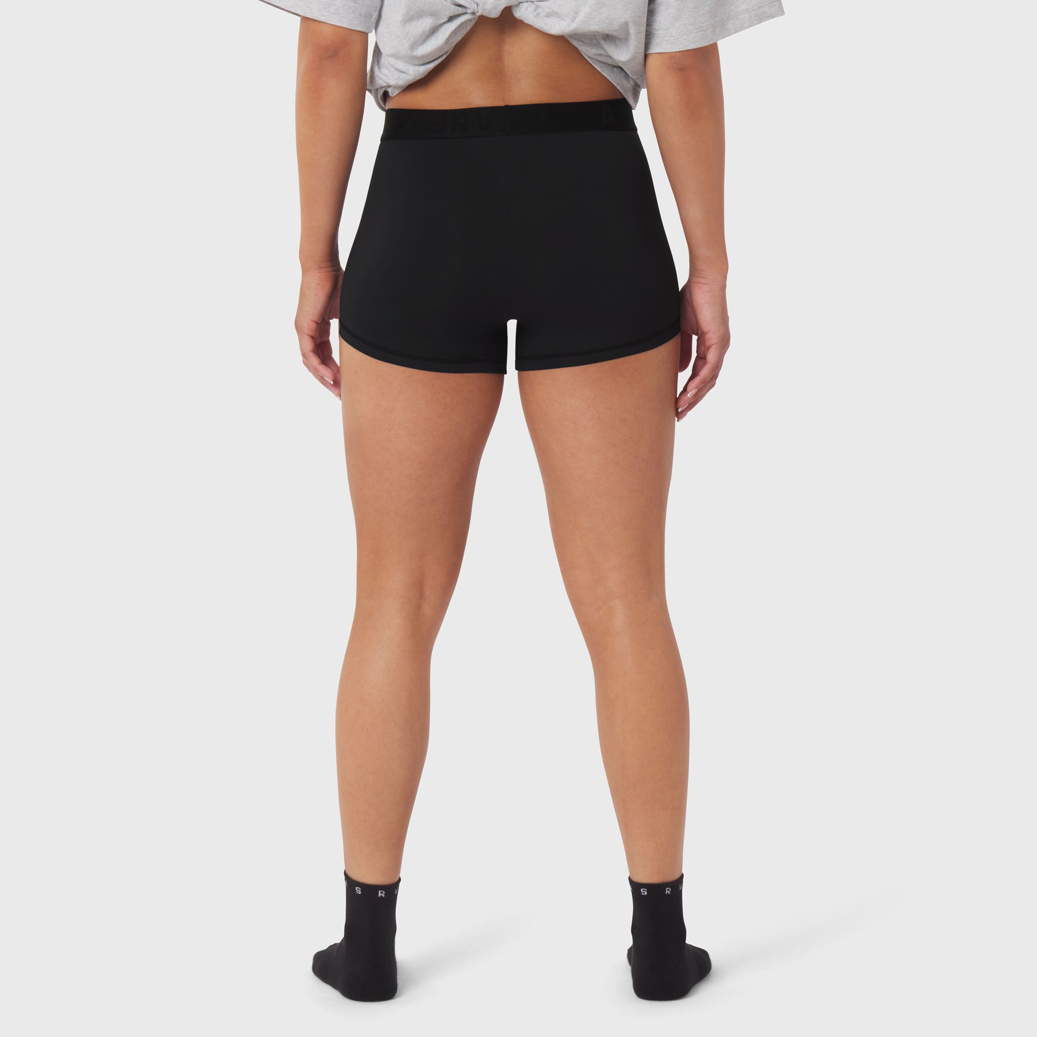 Black LYCRA® ADAPTIV Briefs worn by model, back view