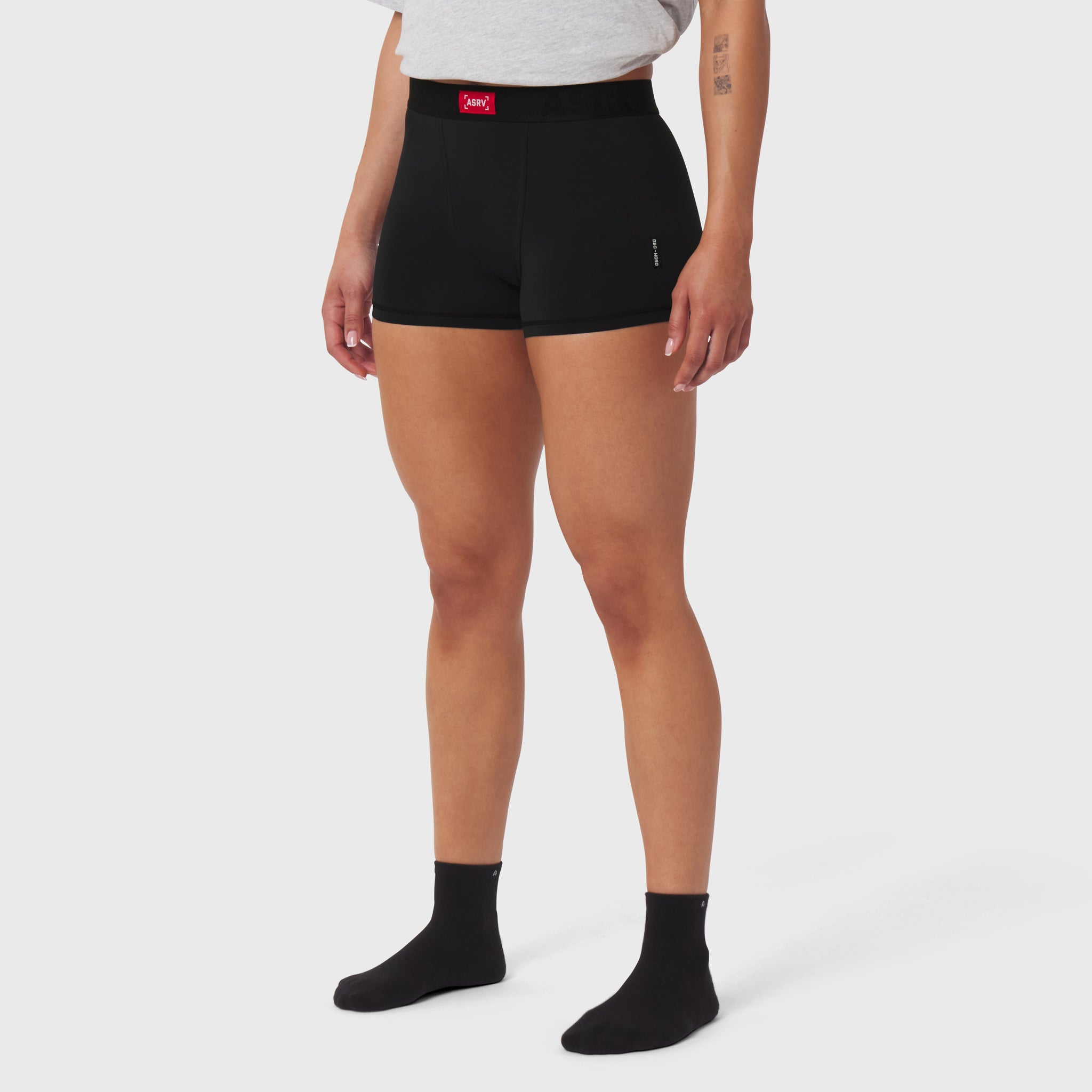 Black LYCRA® ADAPTIV briefs worn by model, front view