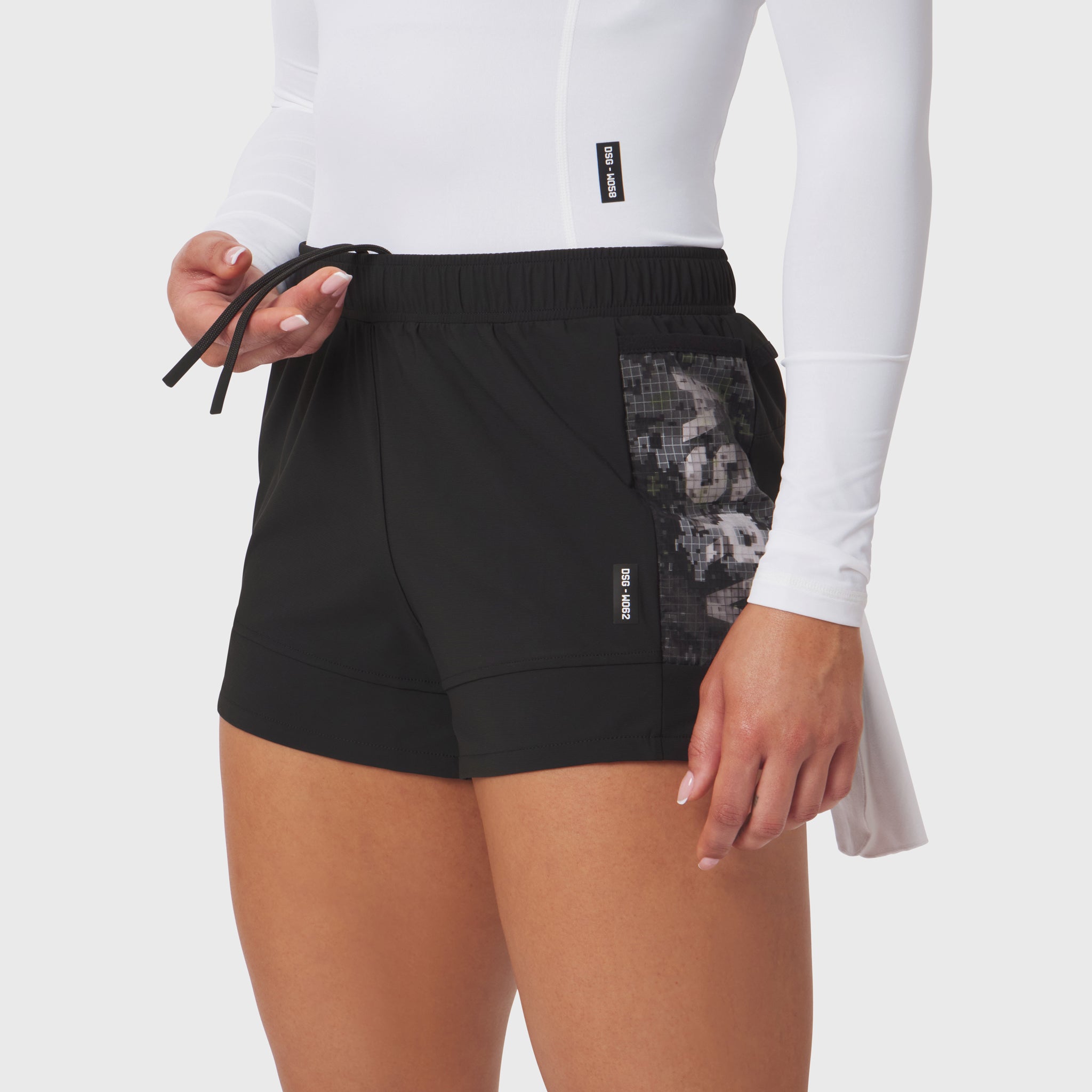 Tetra-Lite Adventure Short in black with mesh pocket detail, worn by model