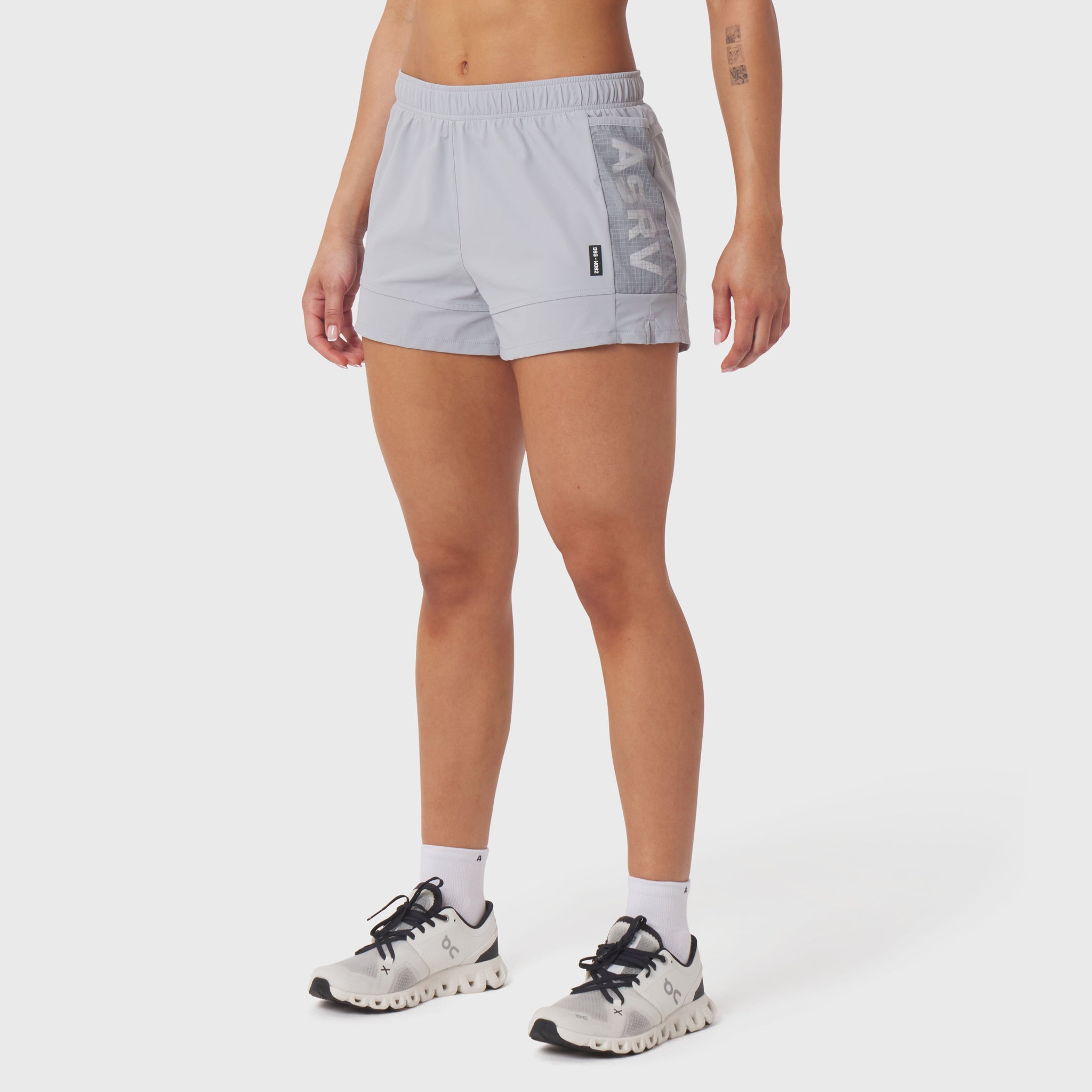 Tetra-Lite Adventure Short in slate grey, worn with white socks and running shoes