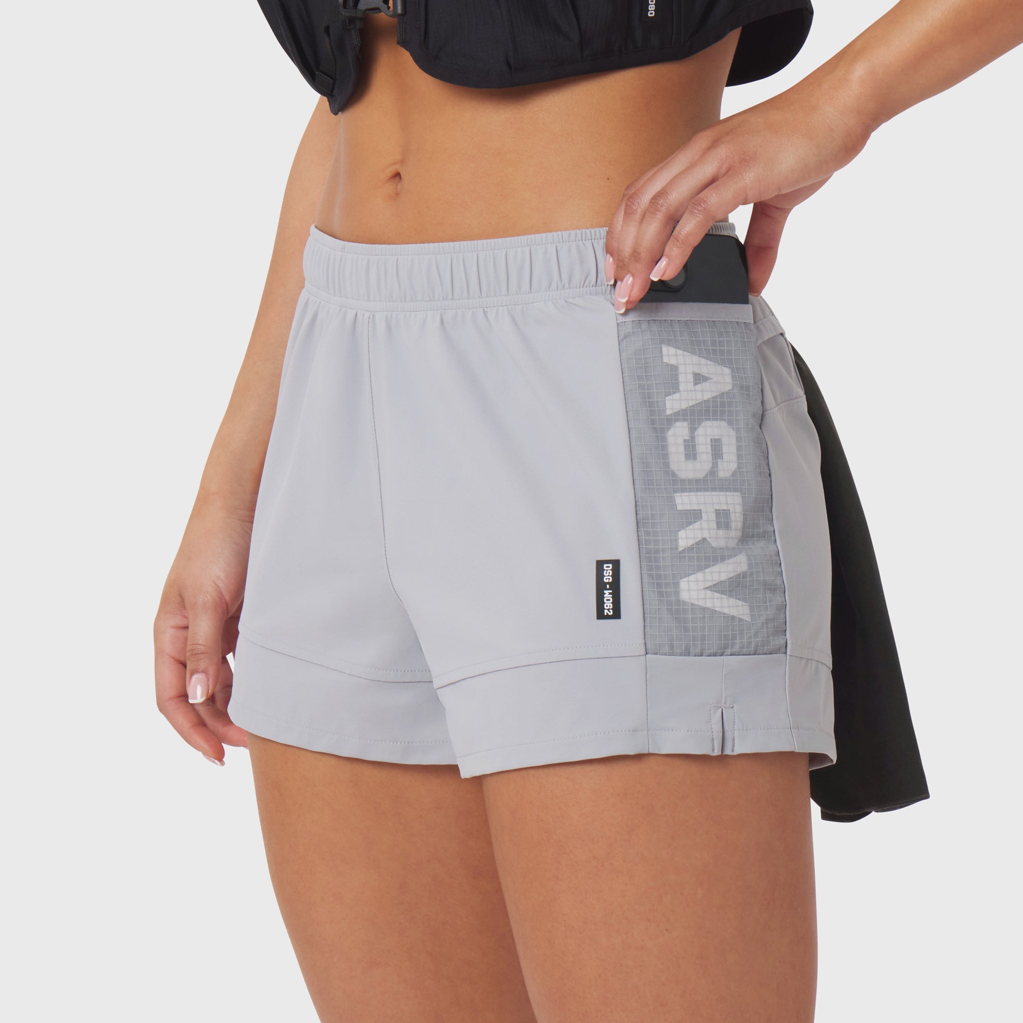 Tetra-Lite Adventure Short in slate grey worn by model, side view with hand in pocket
