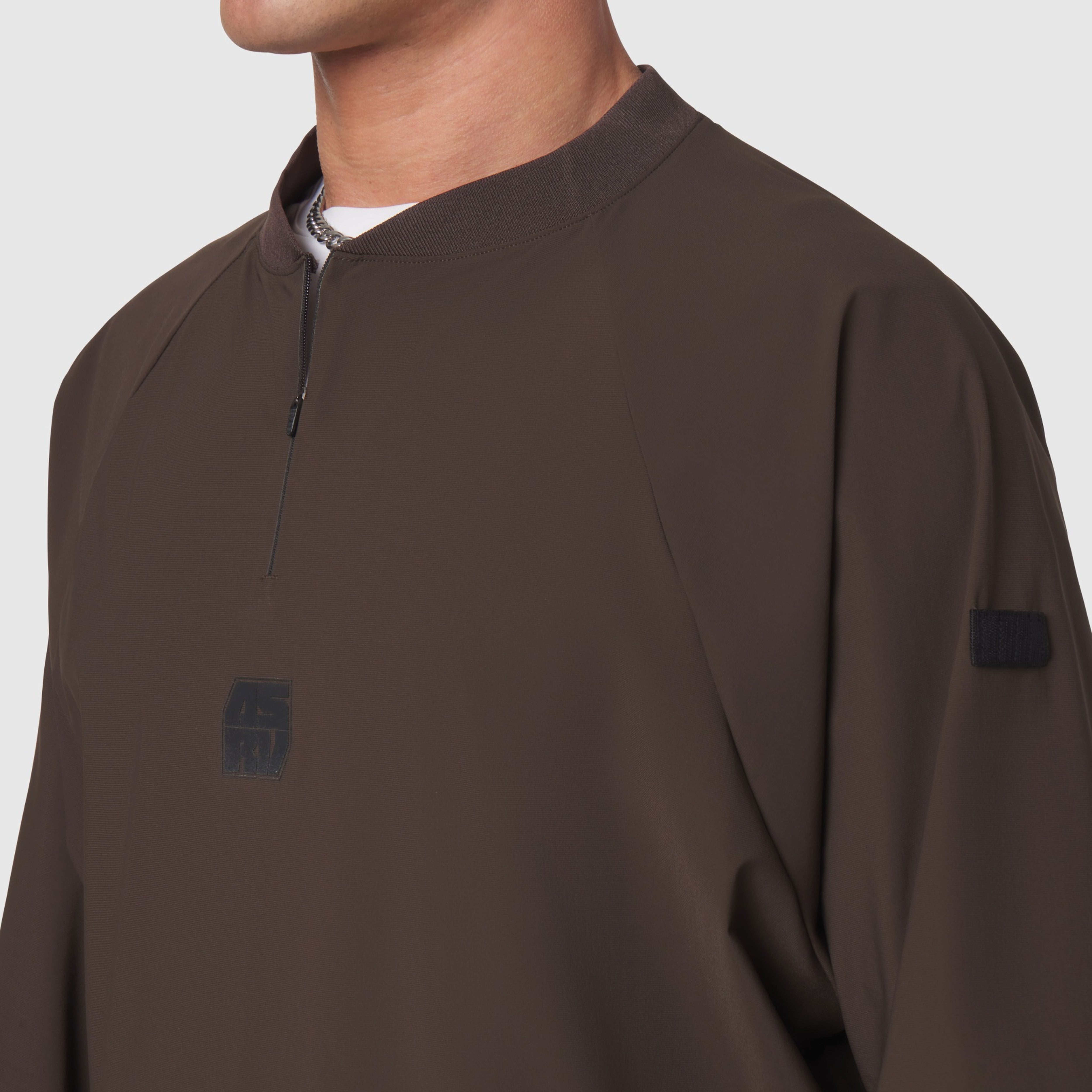 Tetra-Lite® Blade Collar Zip Jacket in dark earth, worn by model, front view