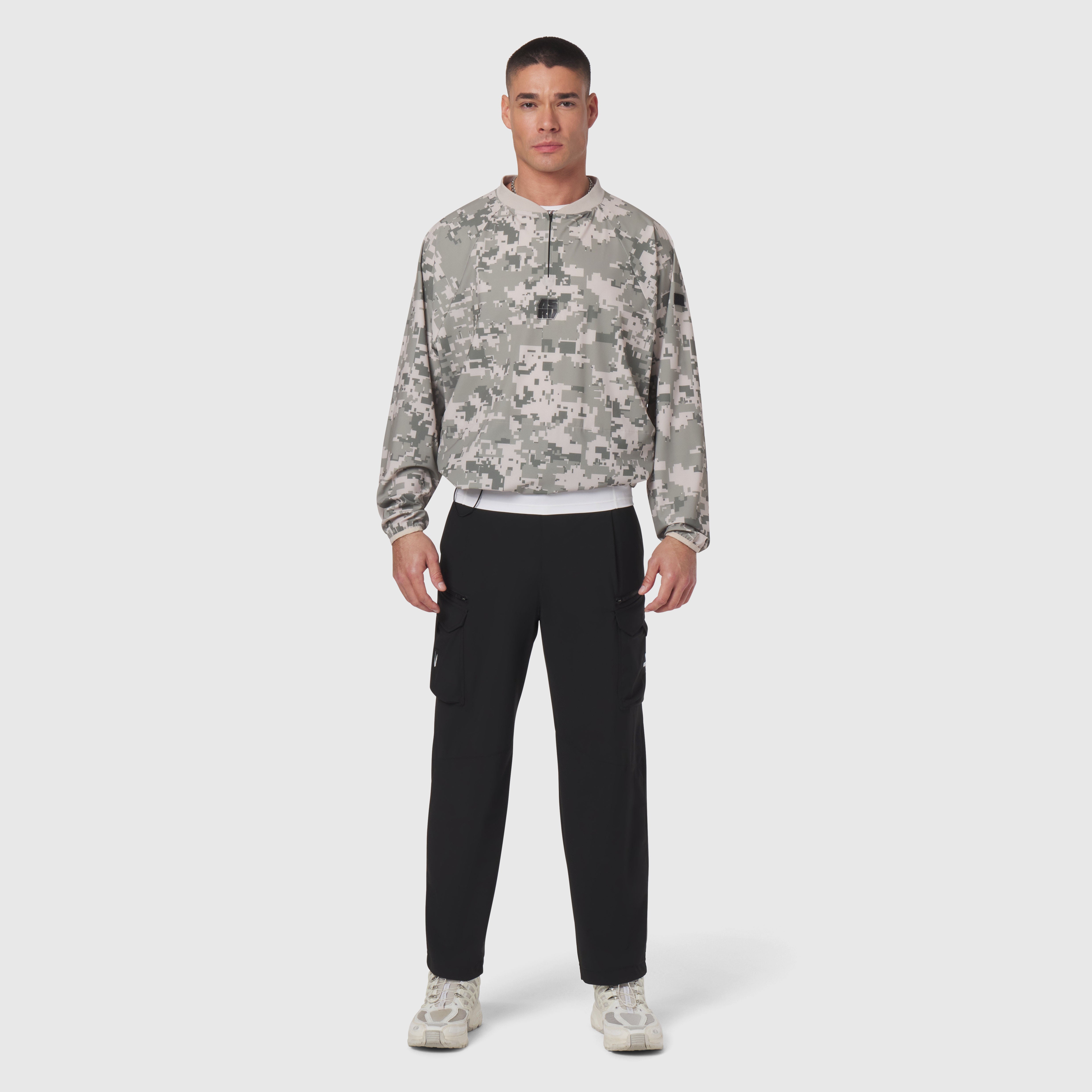 Tetra-Lite Blade Collar Zip Jacket in digital camo, worn with black cargo pants, front view