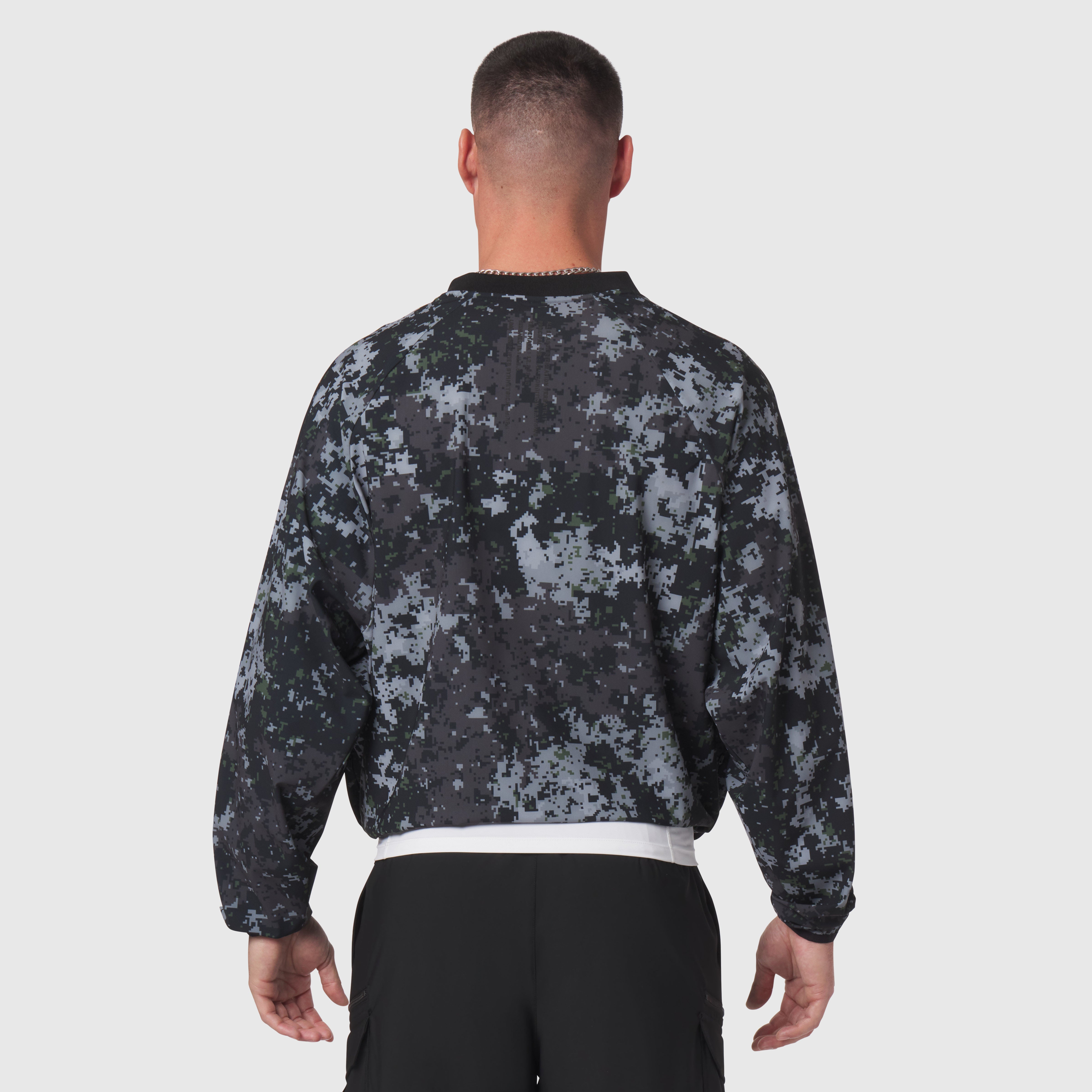 Tetra-Lite Blade Collar Zip Jacket in pixel camo, back view on model