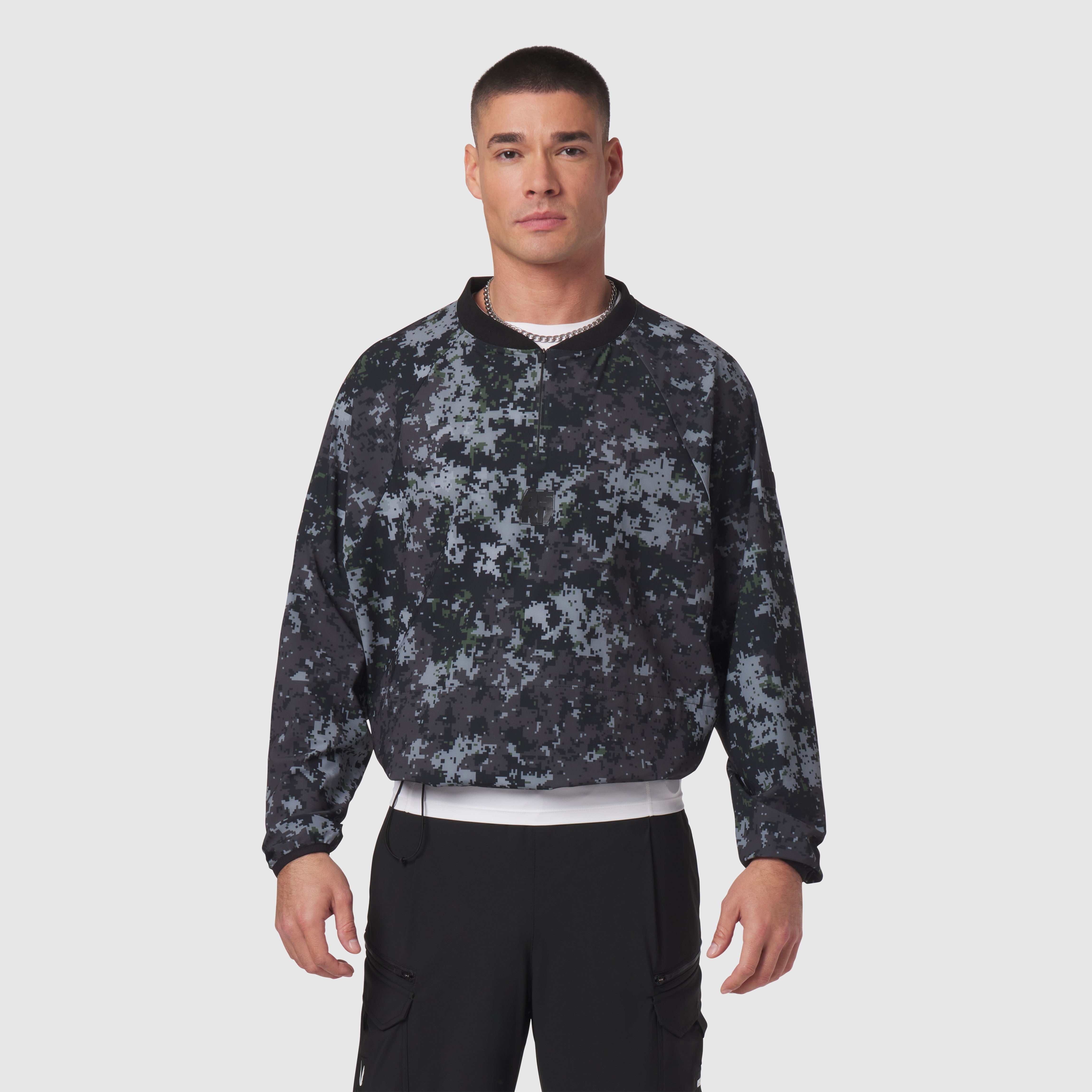 Tetra-Lite Blade Collar Zip Jacket in black pixel camo, worn by model front view