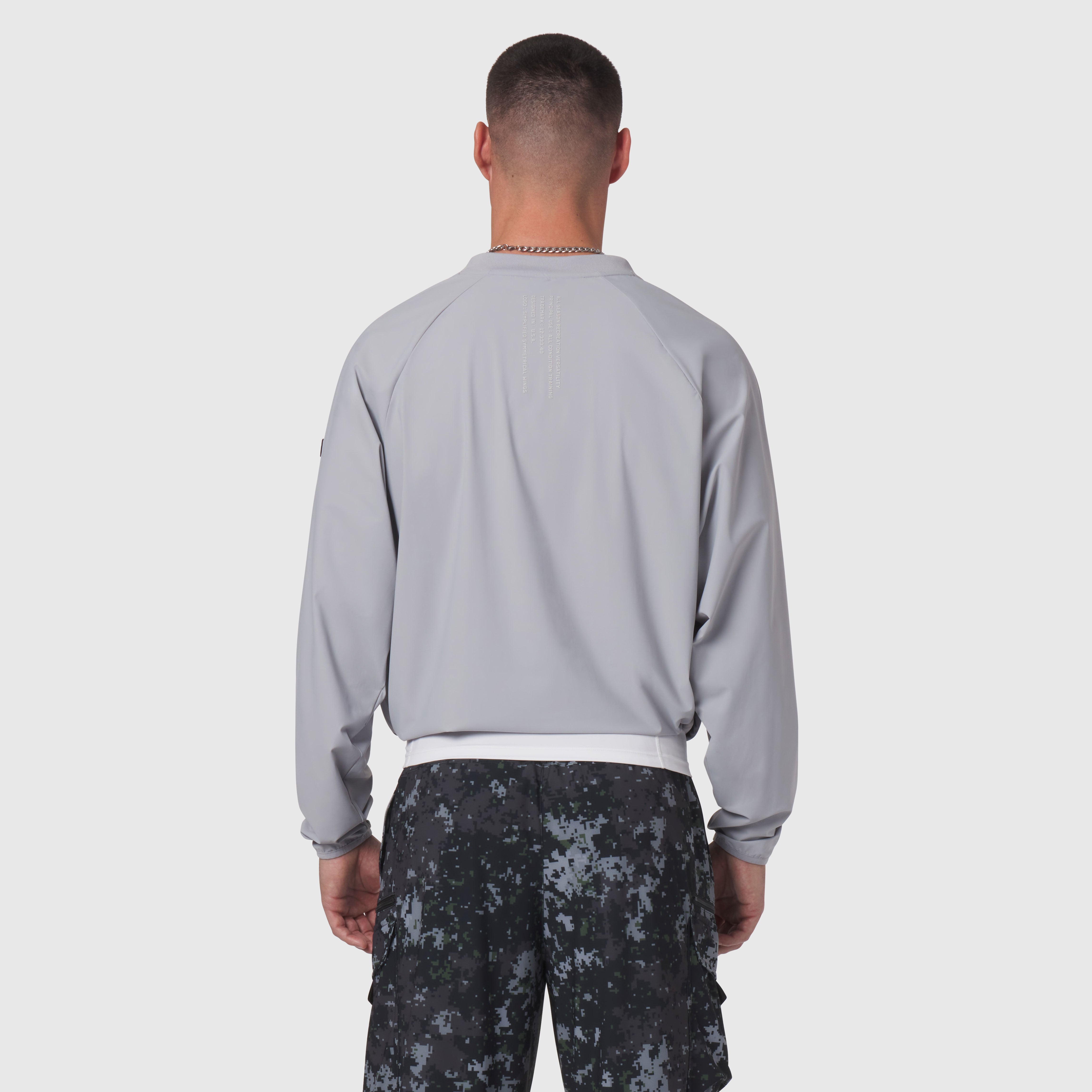 Tetra-Lite Blade Collar Zip Jacket in slate grey, worn by model from back view