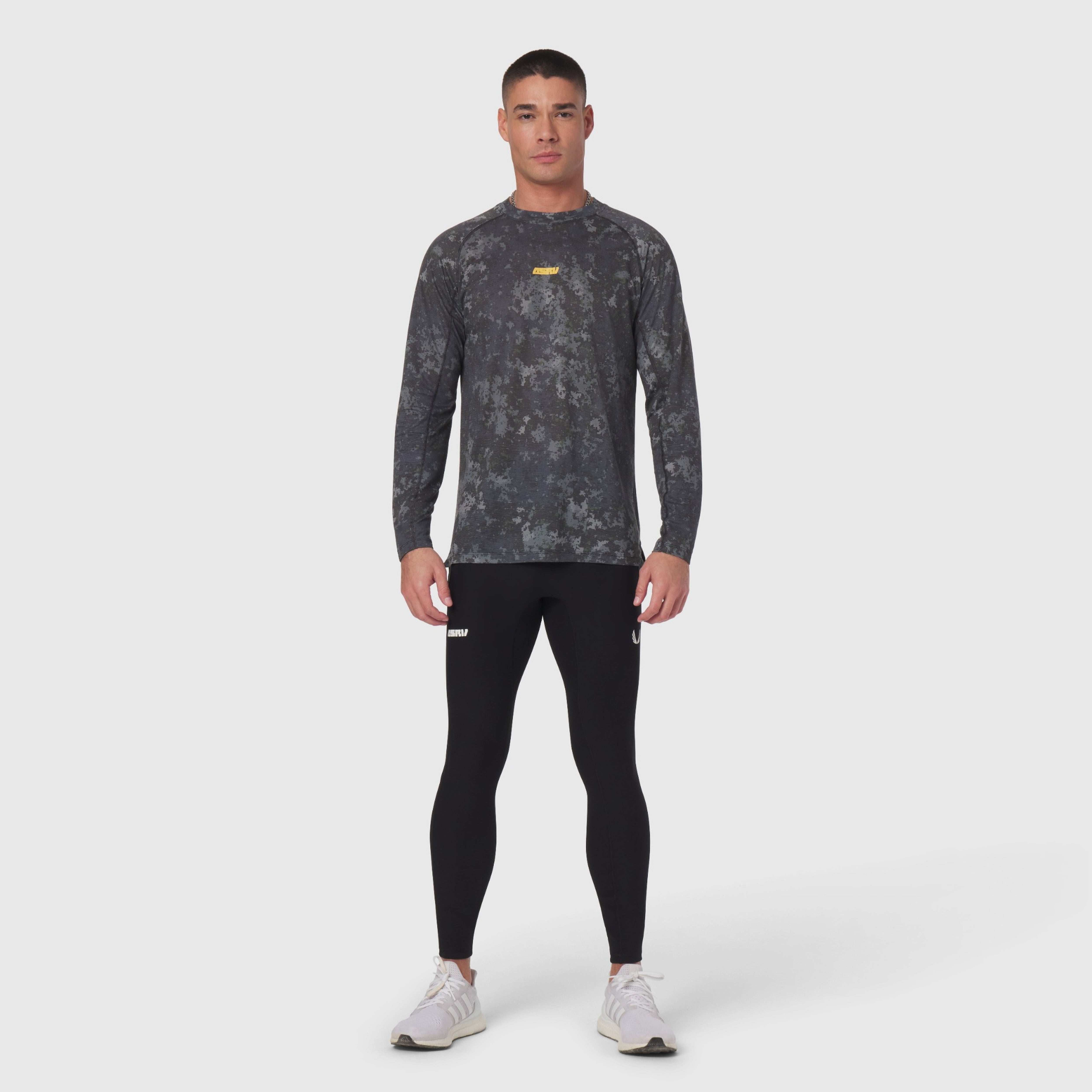 Polartec® Delta Longsleeve in pixel camo gray, styled with black leggings on model
