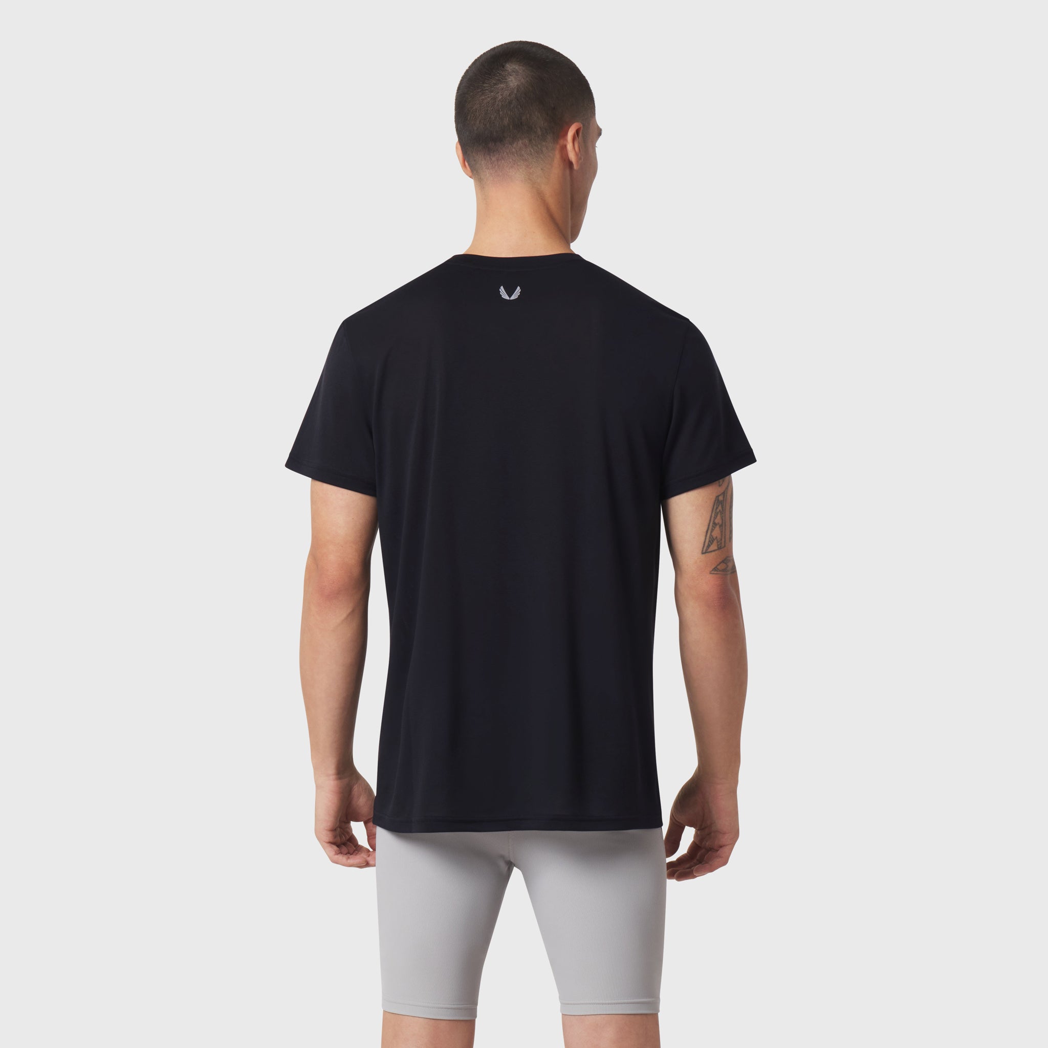 Black Polartec® Delta Training Tee worn by model, back view