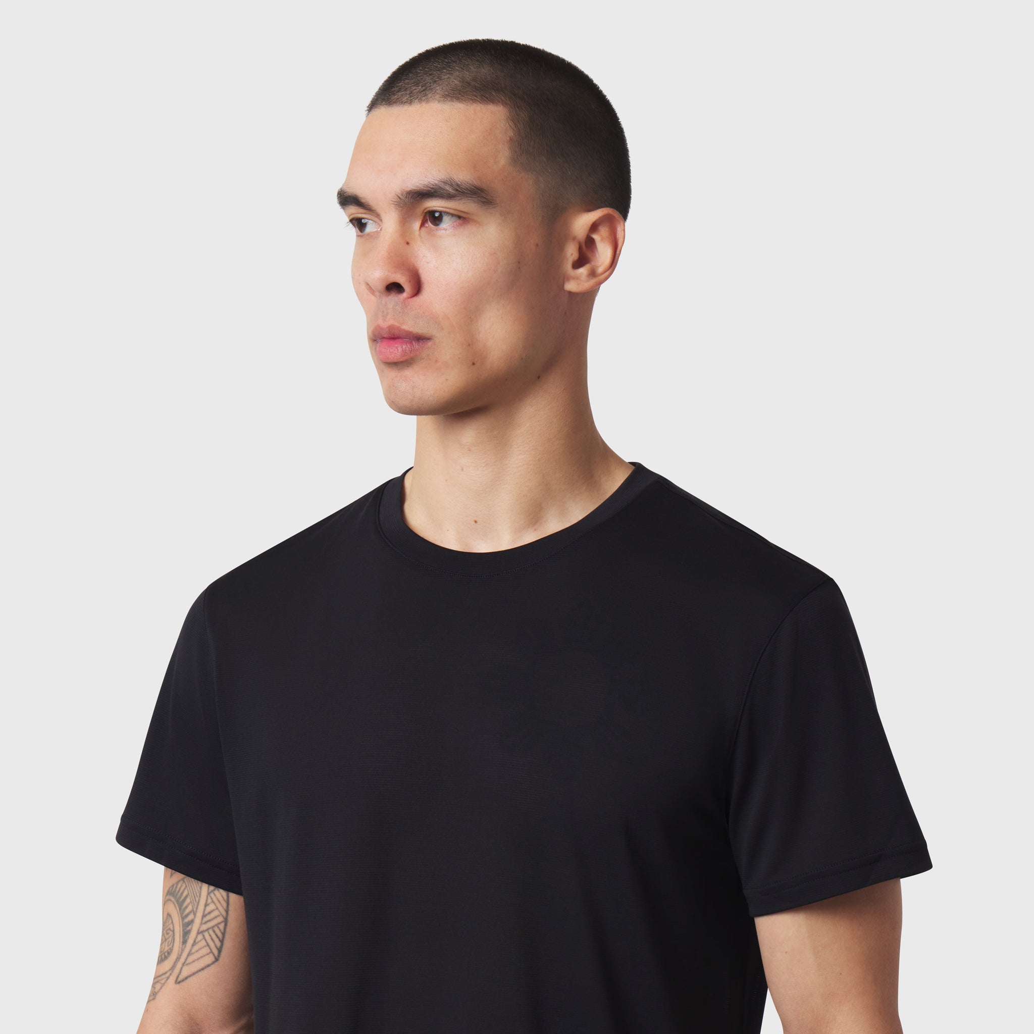 Black Polartec® Delta Training Tee worn by model, side profile view