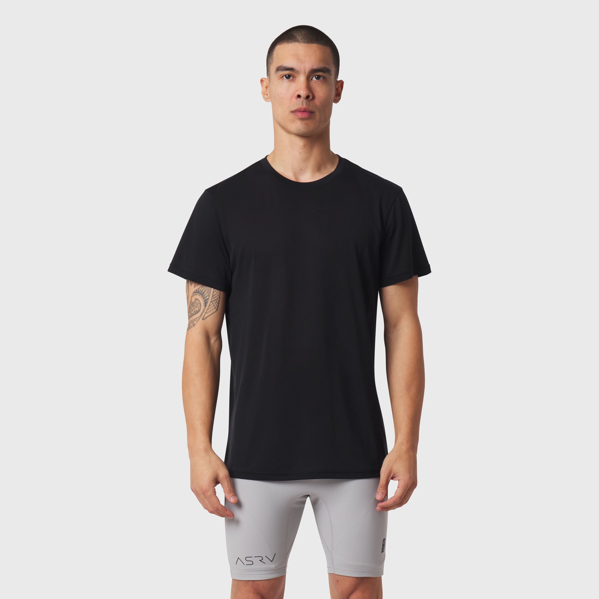 Black Polartec® Delta Training Tee worn with gray shorts, front view on model