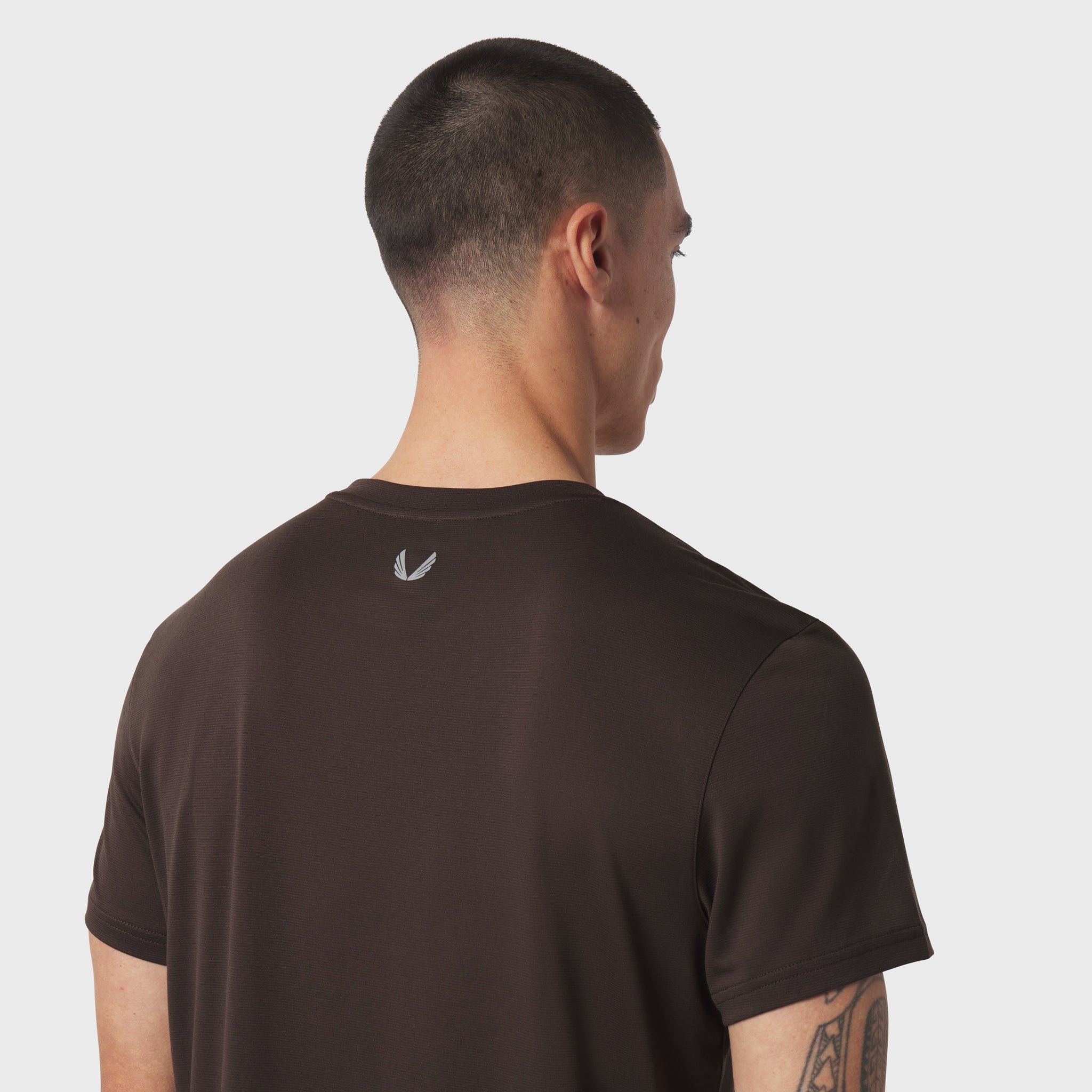 Polartec® Delta Training Tee in dark earth, rear view on model