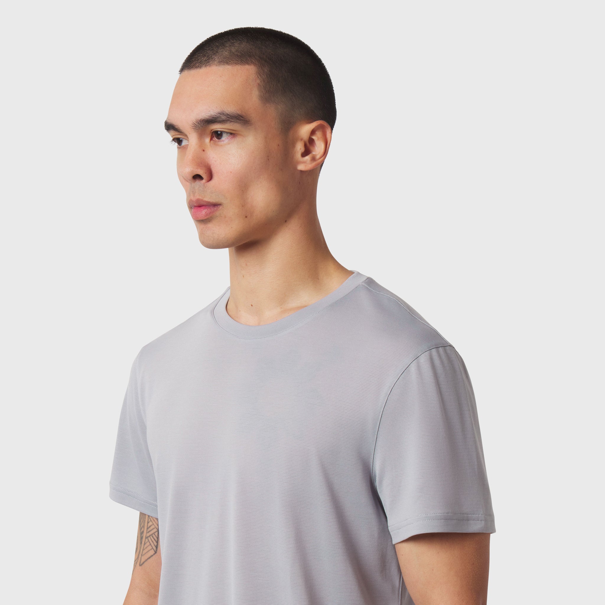 Polartec® Delta Training Tee in slate grey, worn by model in profile view