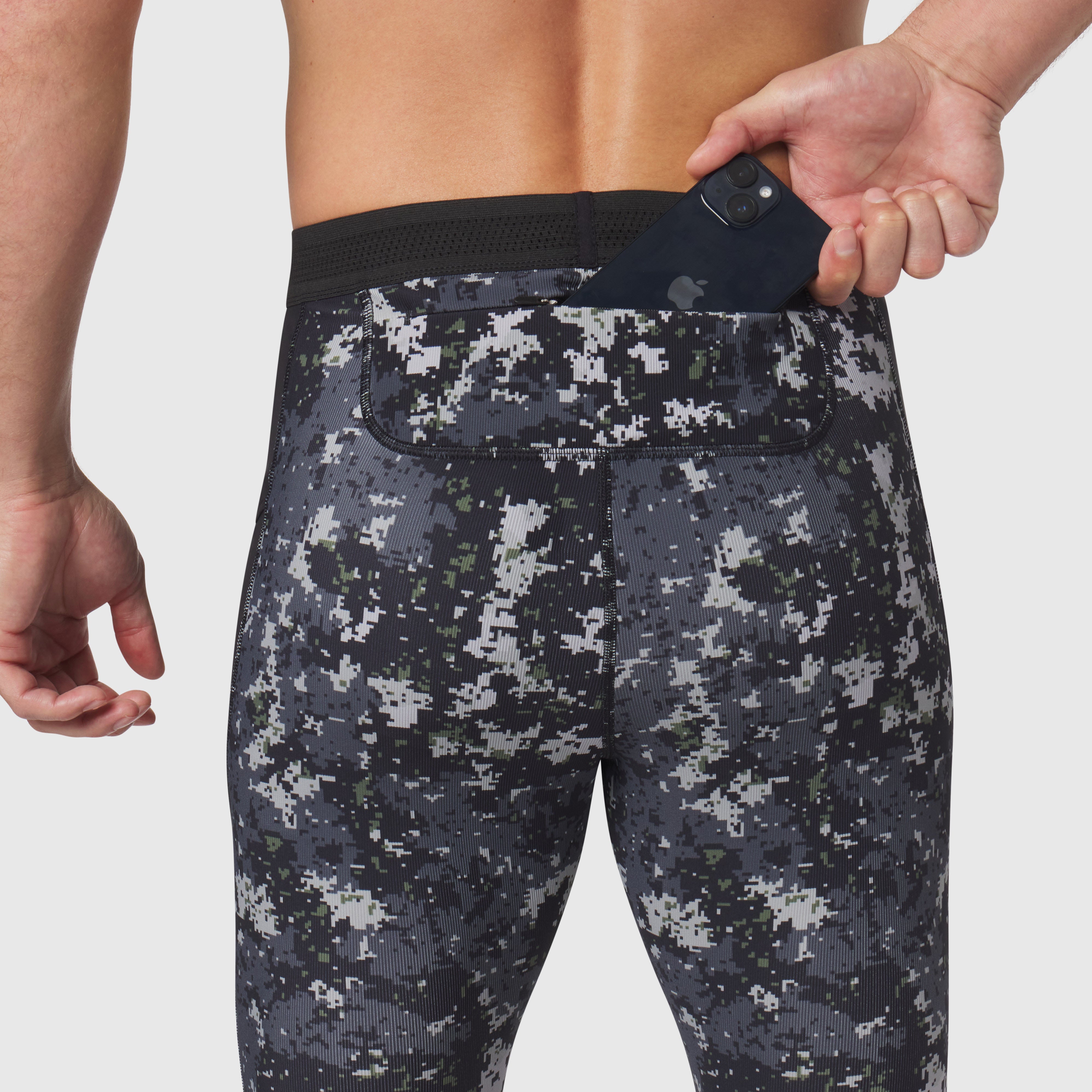 Lycra® Ribbed Running Tight in pixel camo worn by model, waistband detail with phone pocket