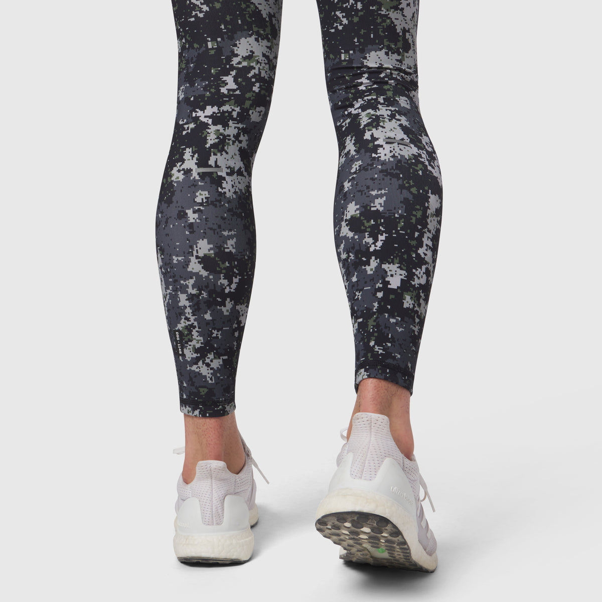 Lycra Ribbed Running Tights in black pixel camo, worn with white sneakers, back view