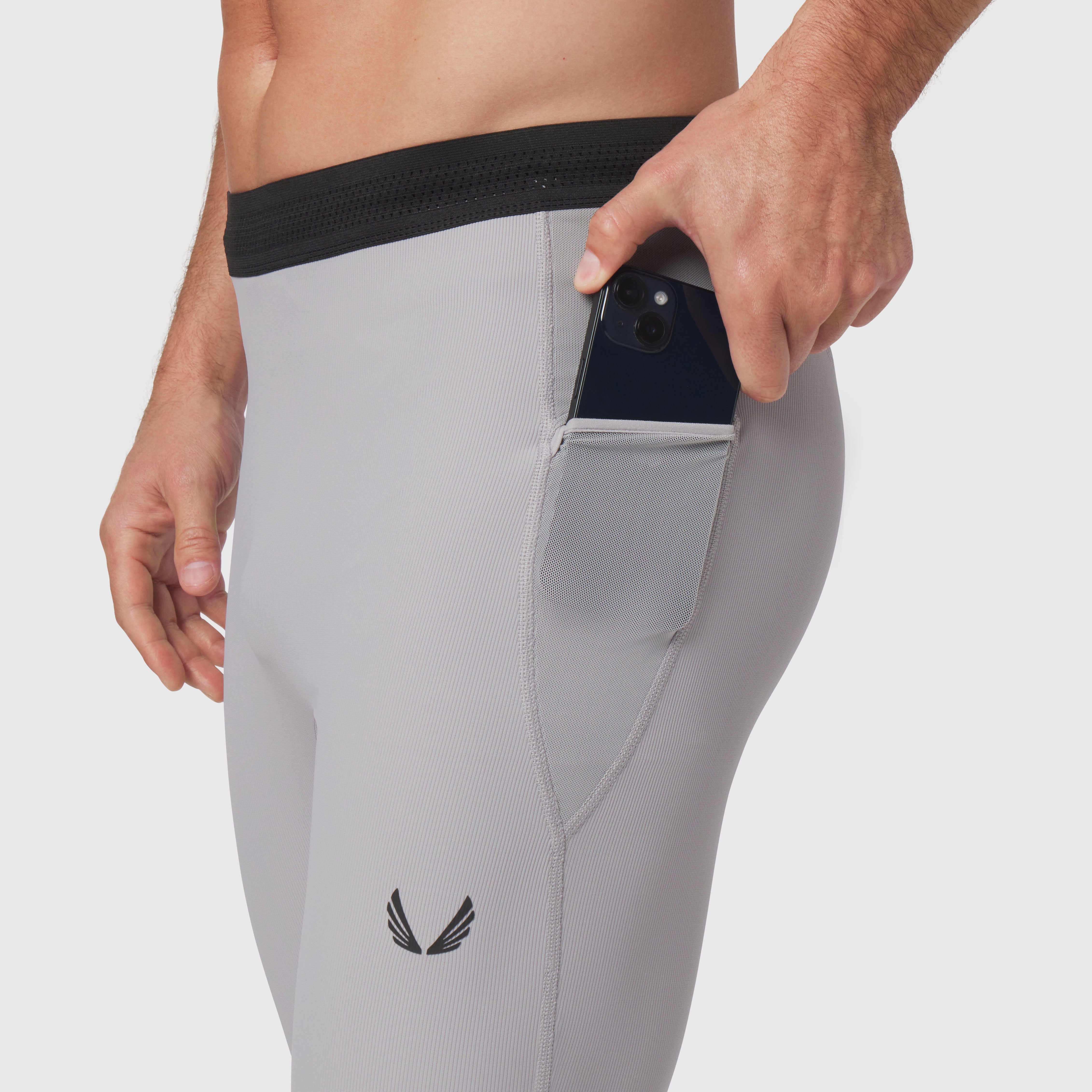 Lycra® Ribbed Running Tight in slate grey worn by model, showing phone pocket detail