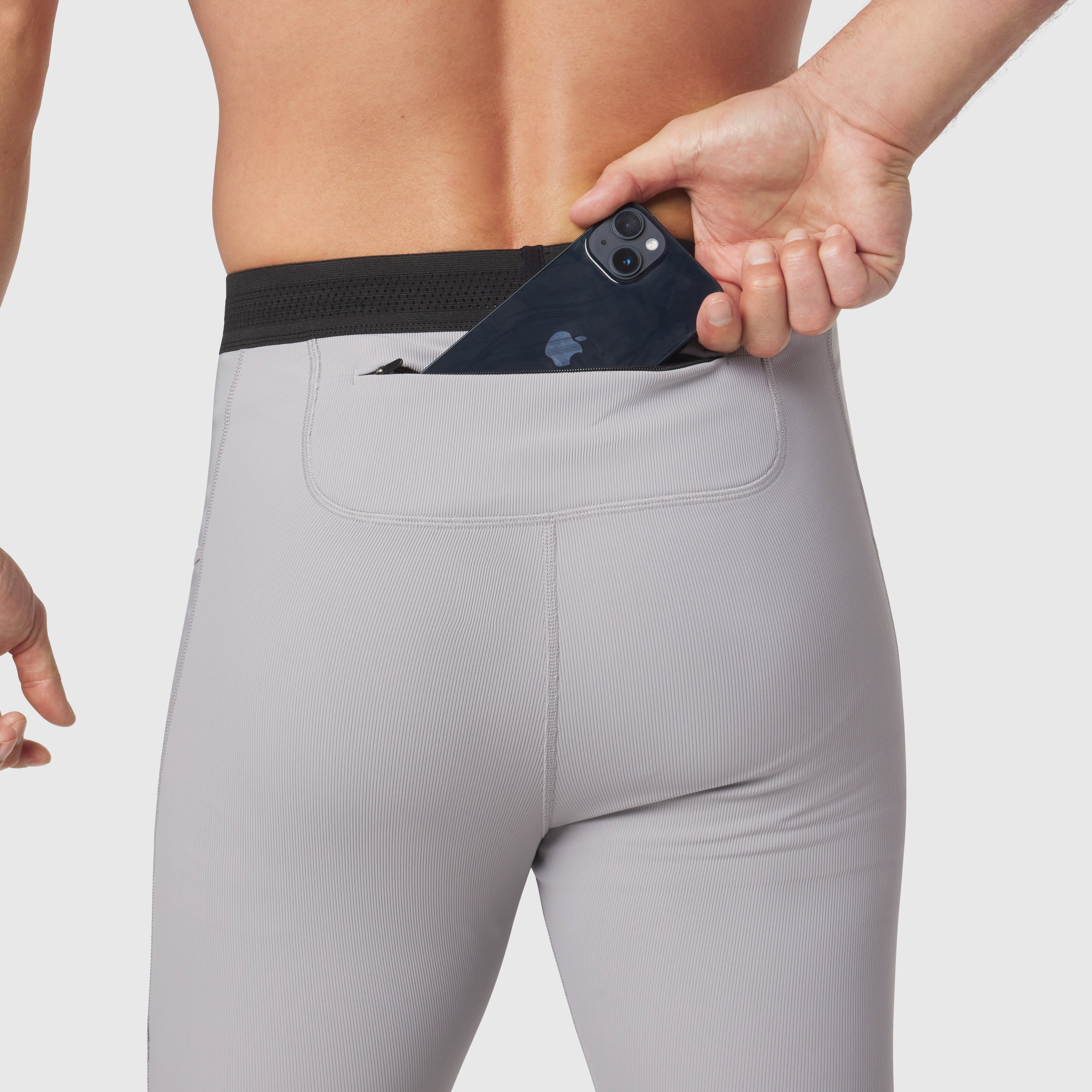 Lycra® Ribbed Running Tight in slate grey, model wearing tights with phone in waistband pocket