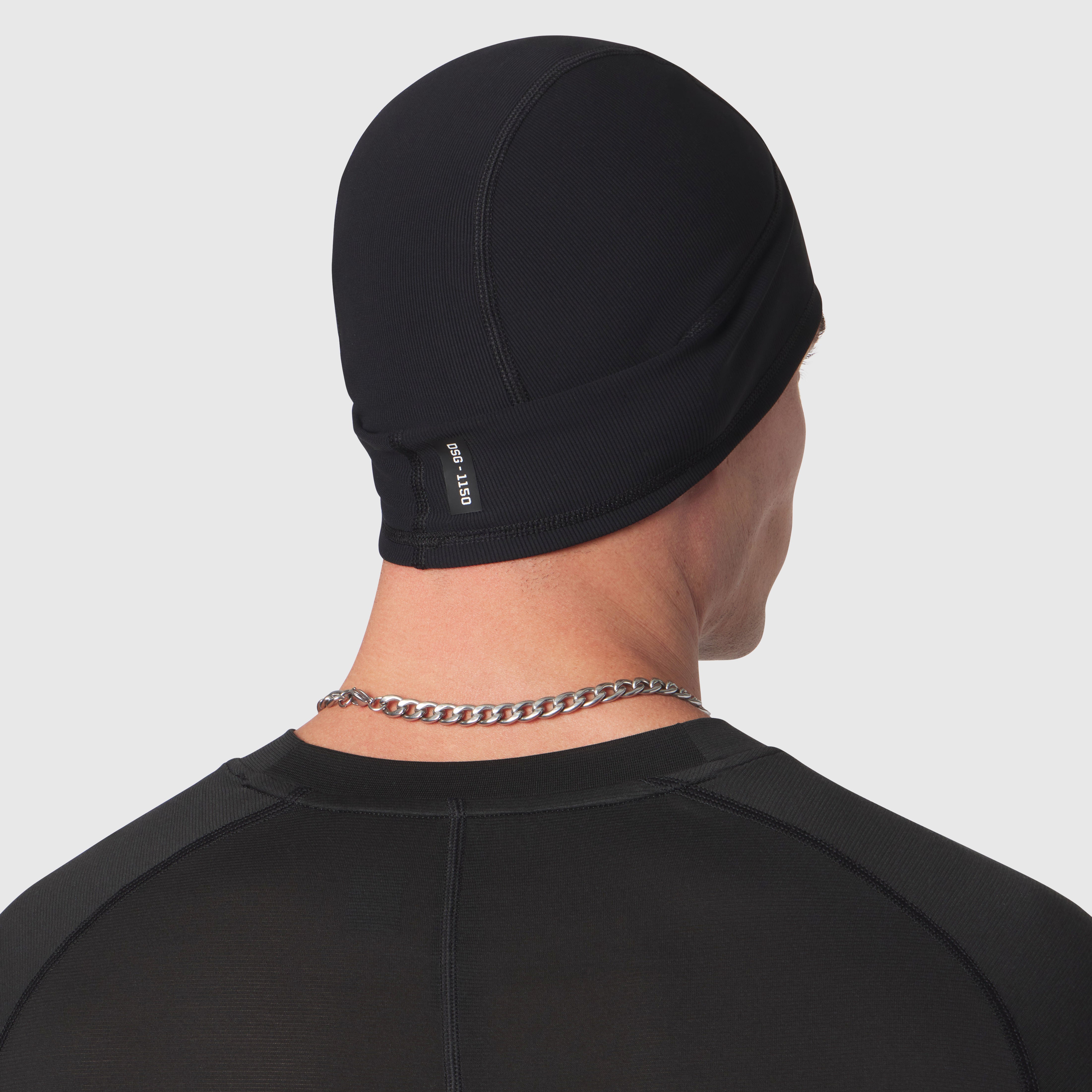Black Lycra® Skully beanie worn on model from back view, showing fit and texture detail