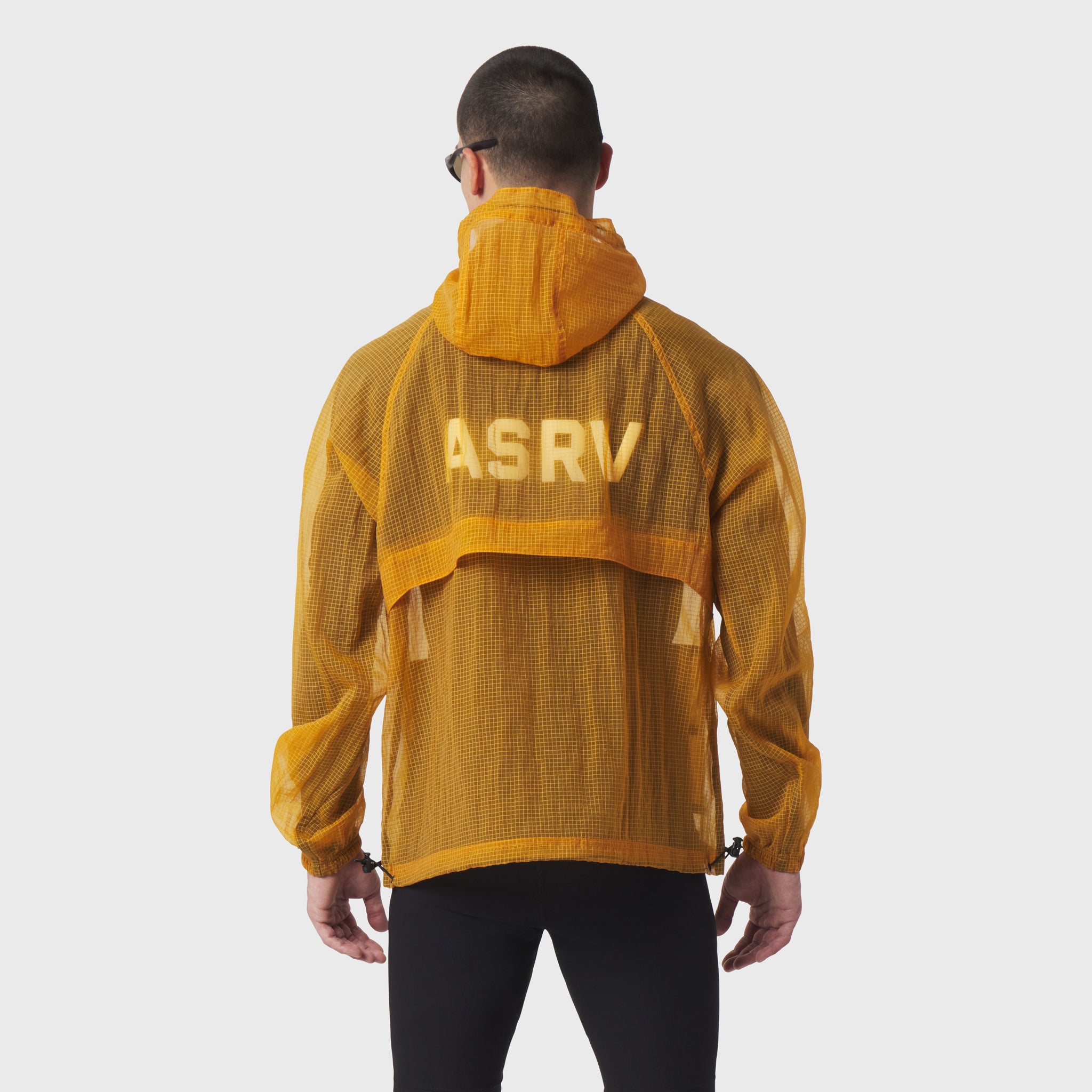 Weather-Ready Transparent Ripstop Shell Jacket in amber, back view on model