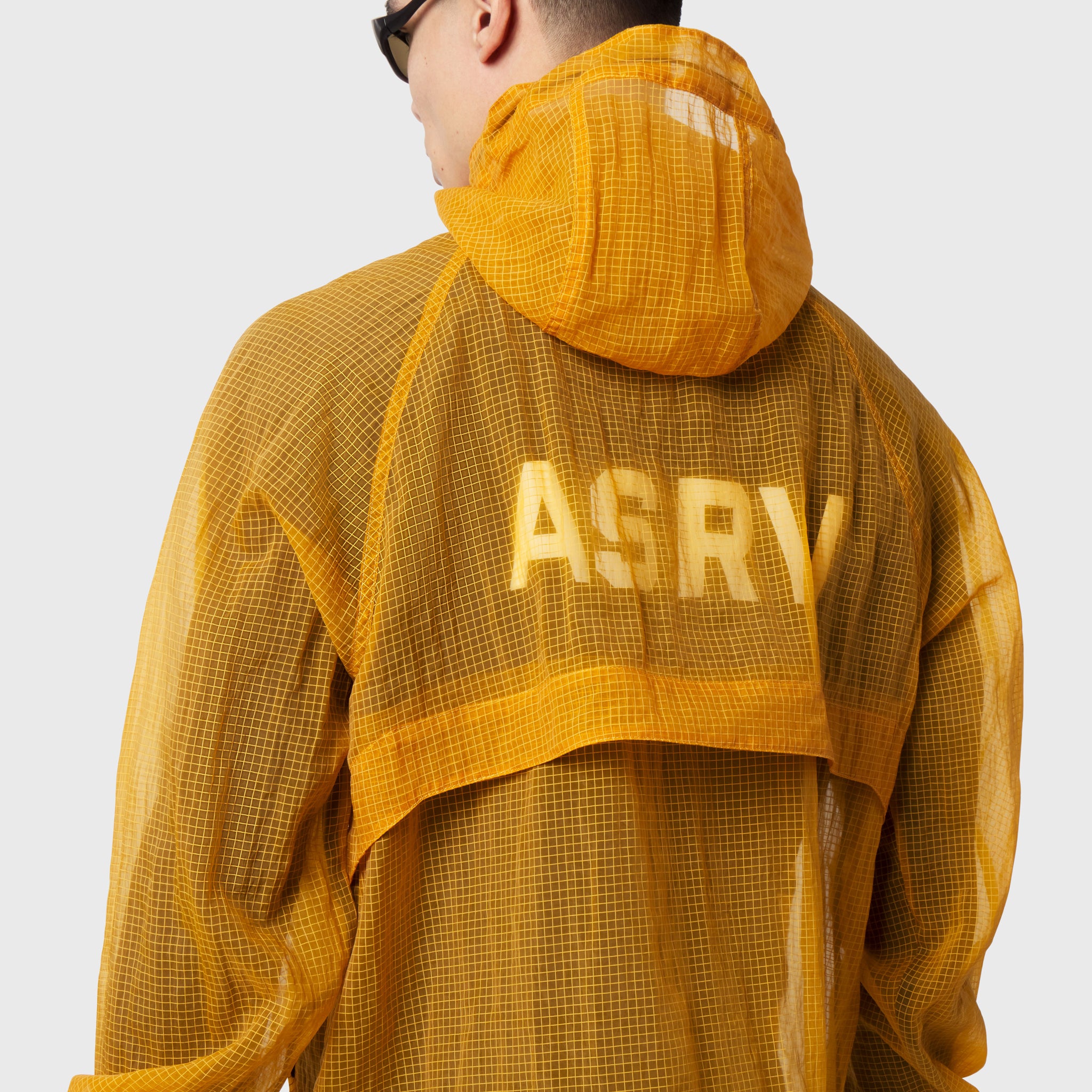 Weather-Ready Transparent Ripstop Shell Jacket in amber, back view on model