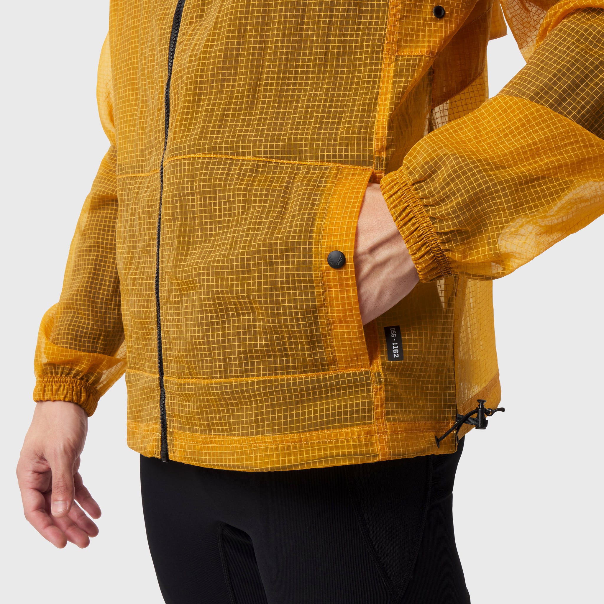 Weather-Ready Transparent Ripstop Shell Jacket in amber, worn by model, side view