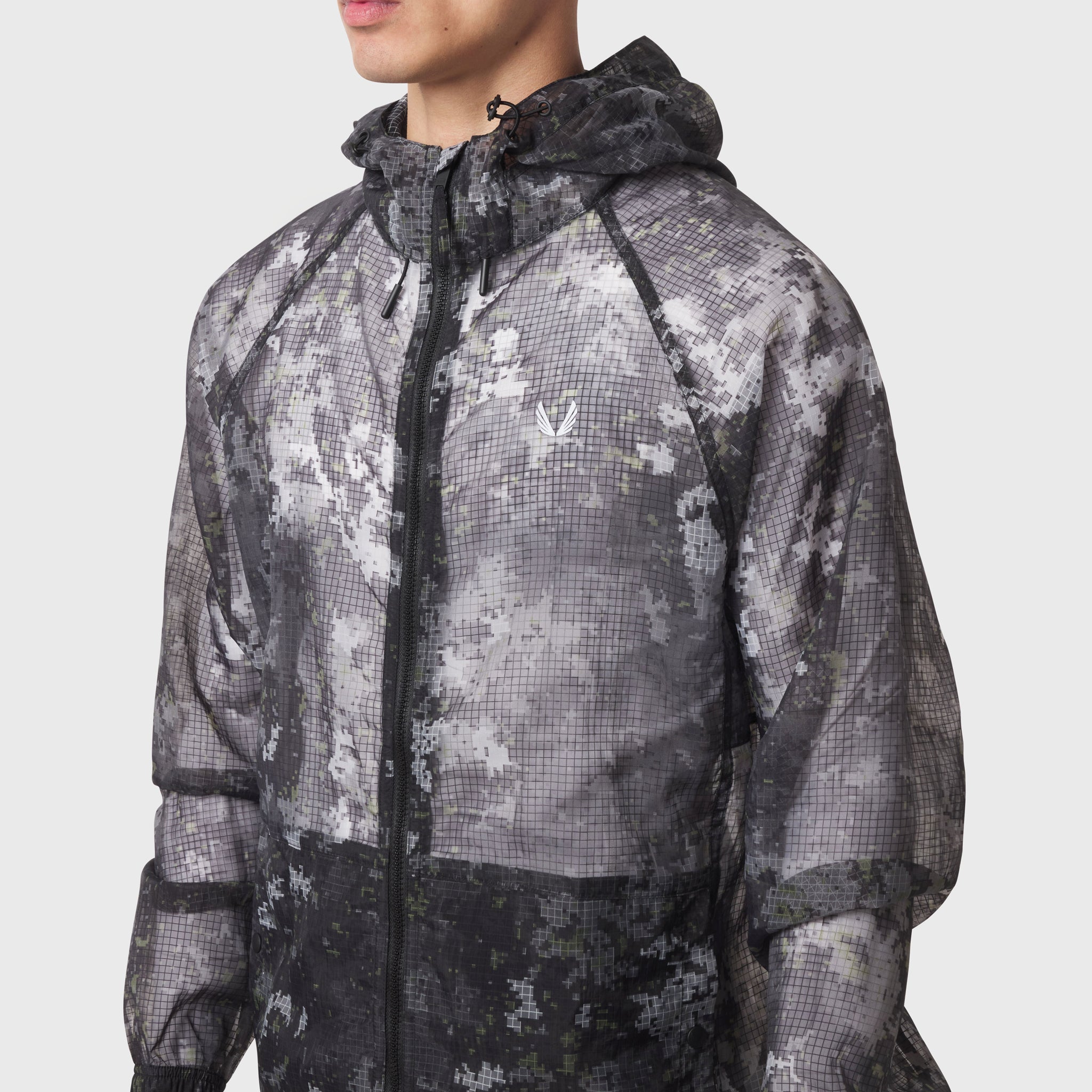 Weather-Ready Transparent Ripstop Shell Jacket in pixel camo, worn by model, front view
