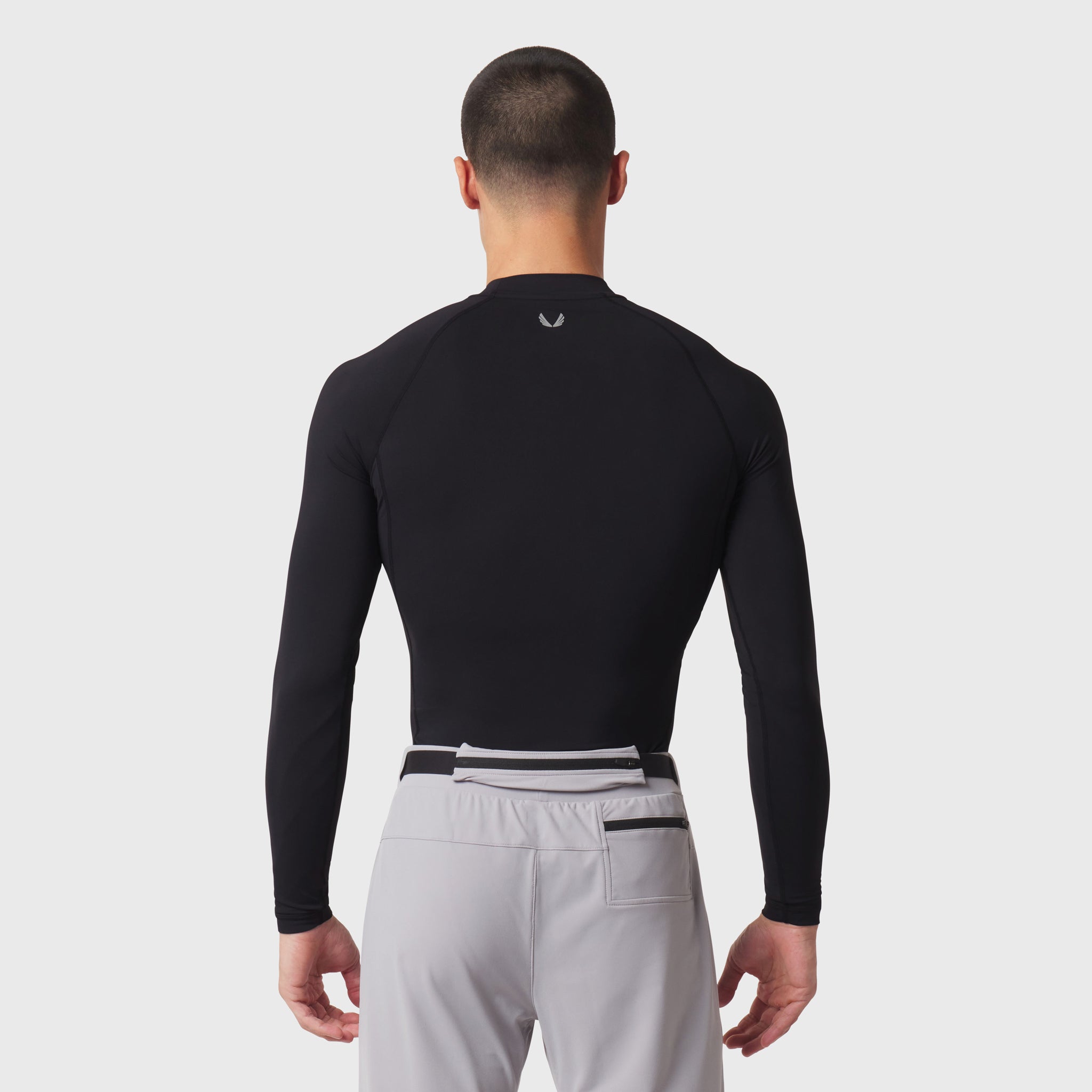 LYCRA® ADAPTIV Baselayer Longsleeve in black, back view on model