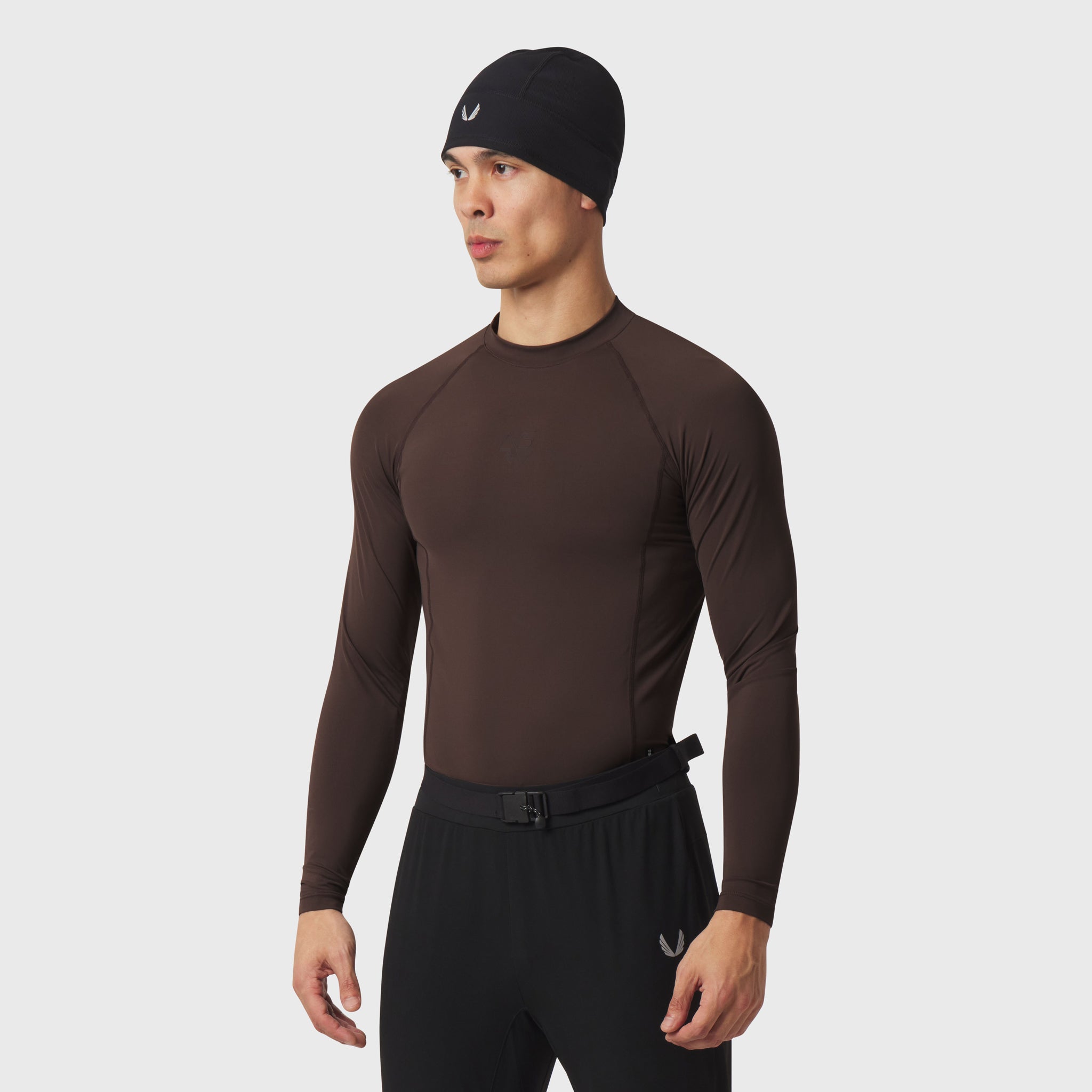 LYCRA® ADAPTIV Baselayer Longsleeve in dark earth brown, worn by model, front view