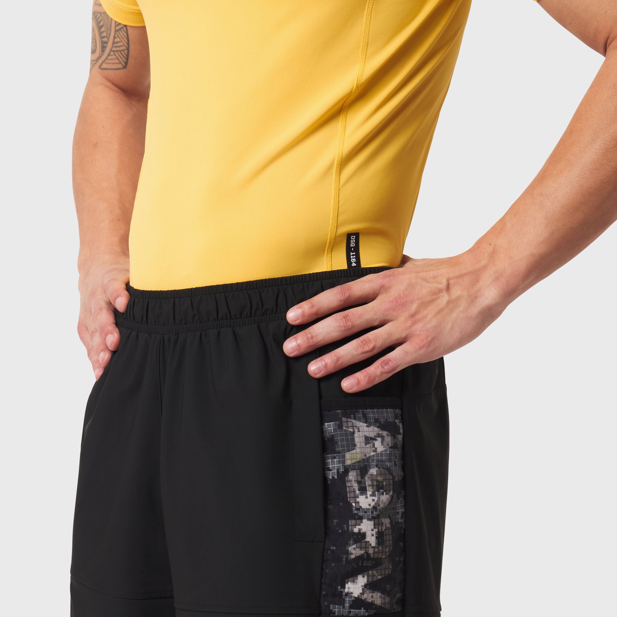 LYCRA® ADAPTIV baselayer shortsleeve in amber yellow worn by model, side view
