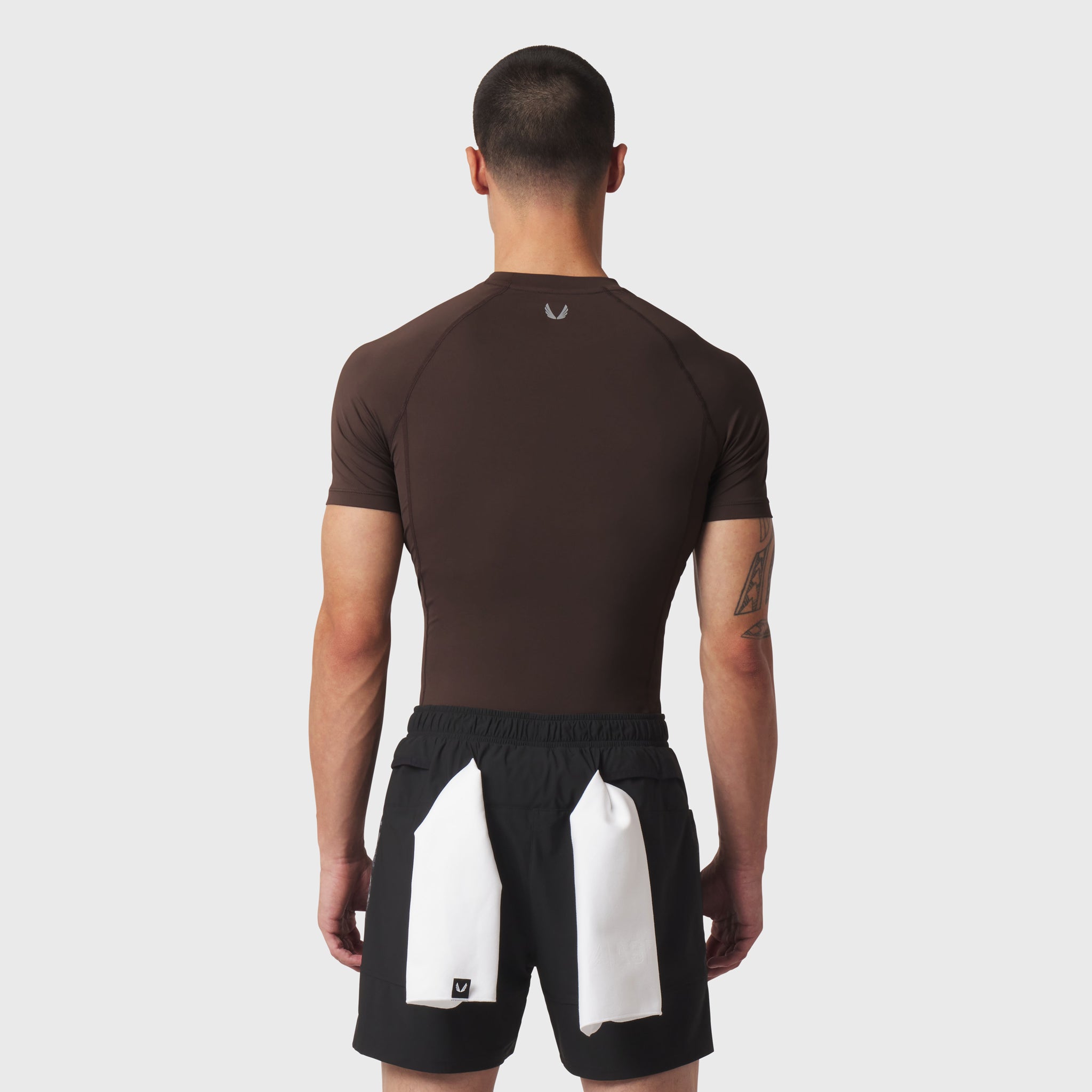 LYCRA® ADAPTIV Baselayer Shortsleeve in dark brown, back view on model