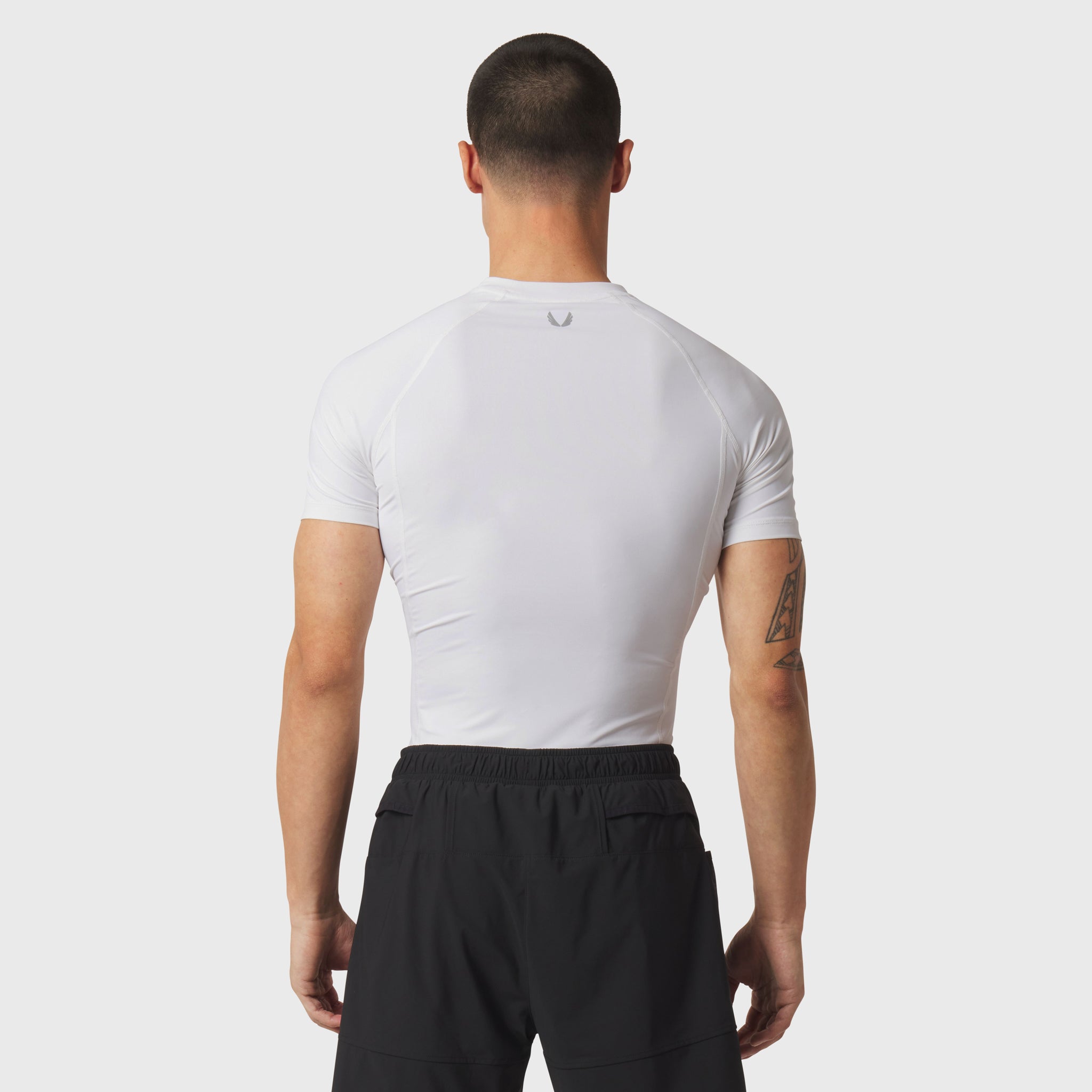 LYCRA® ADAPTIV Baselayer Shortsleeve in white, back view on model
