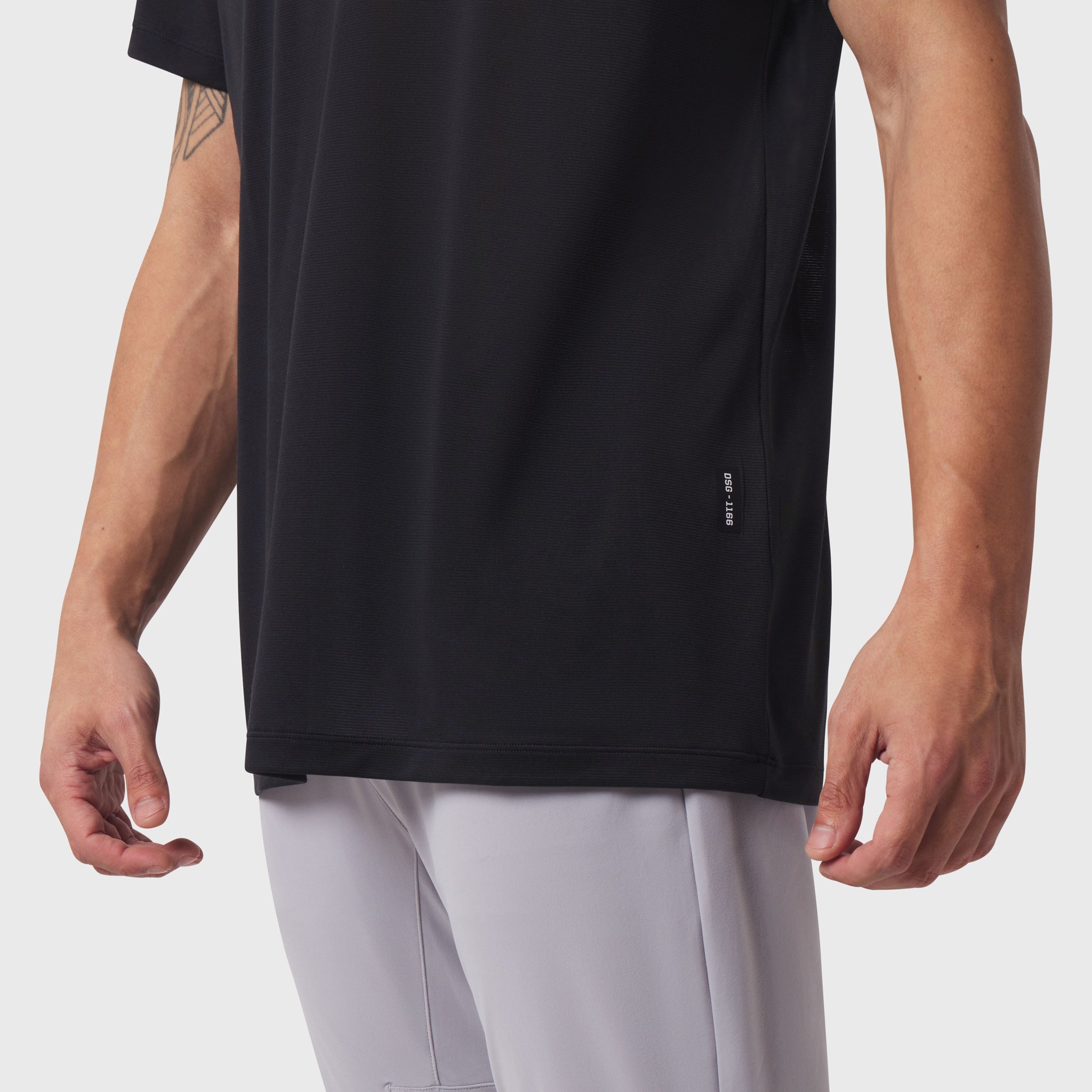 Black Polartec Delta Polo worn by model, front side view