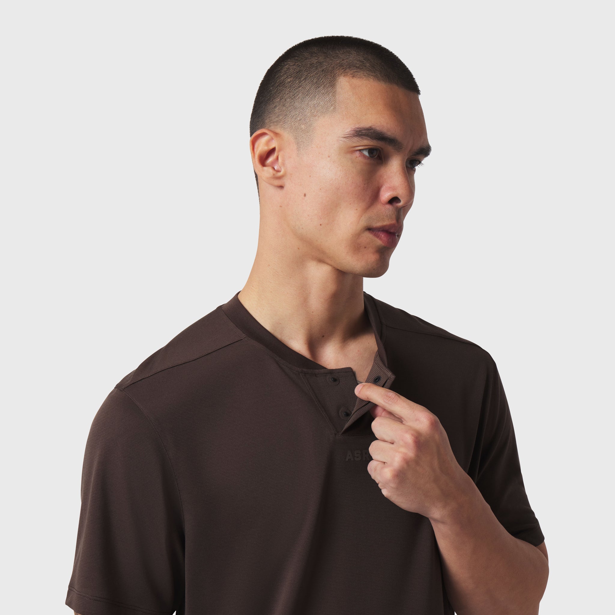 Polartec® Delta Polo in dark earth, worn by model in profile view